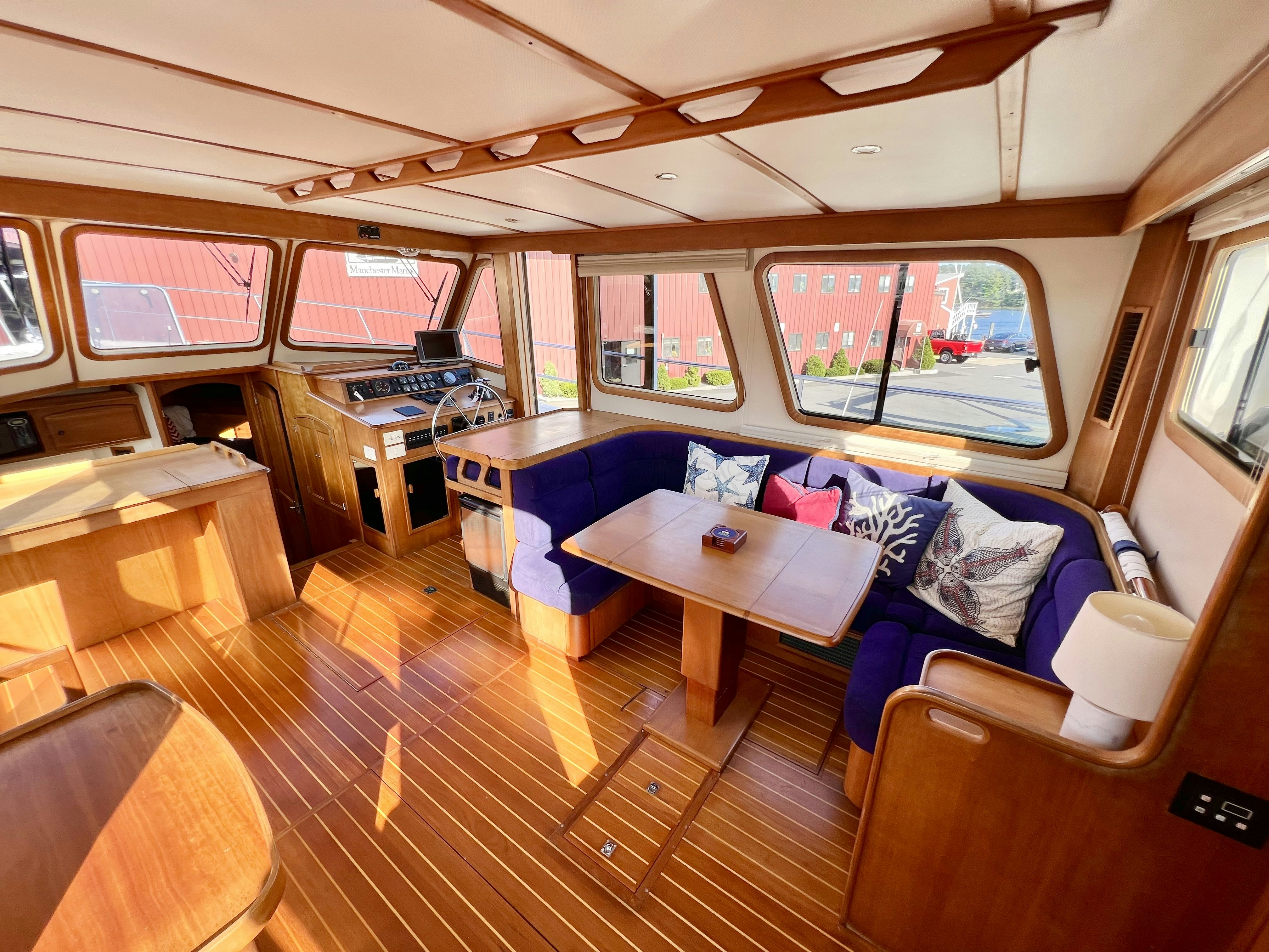 a room with a couch and a table aboard SWAMP FOX Yacht for Sale
