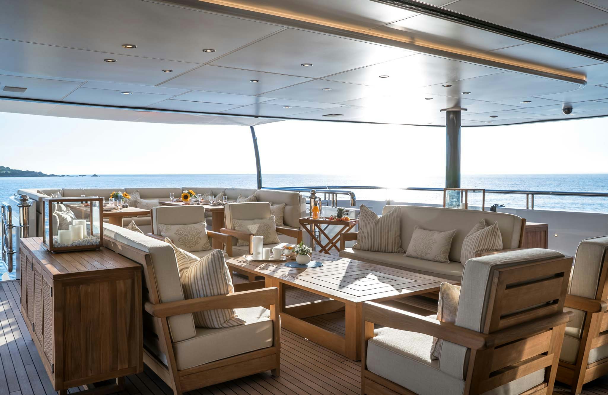 a room with a table and chairs aboard STARFIRE Yacht for Charter