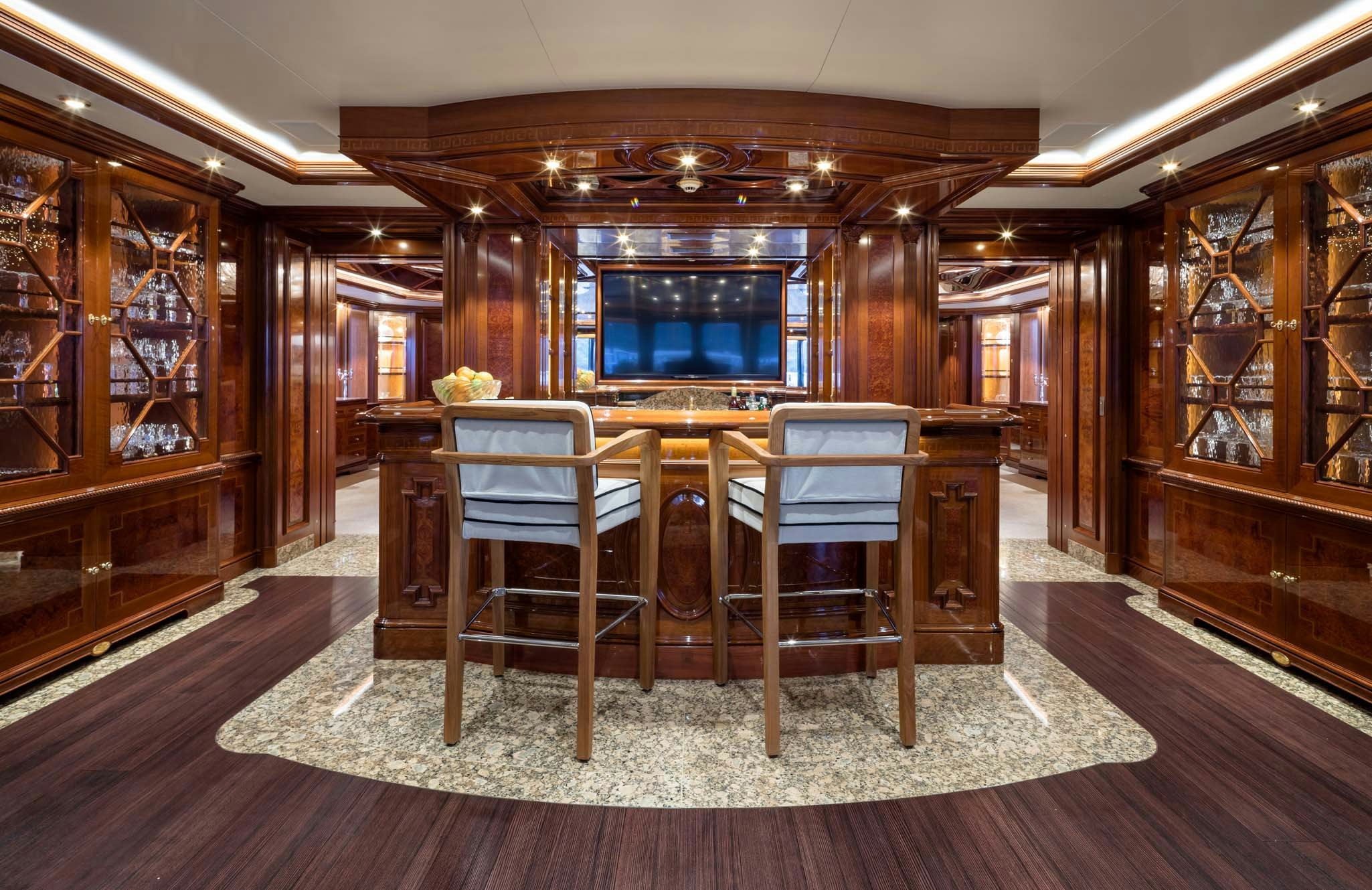 a room with a table and chairs aboard STARFIRE Yacht for Charter