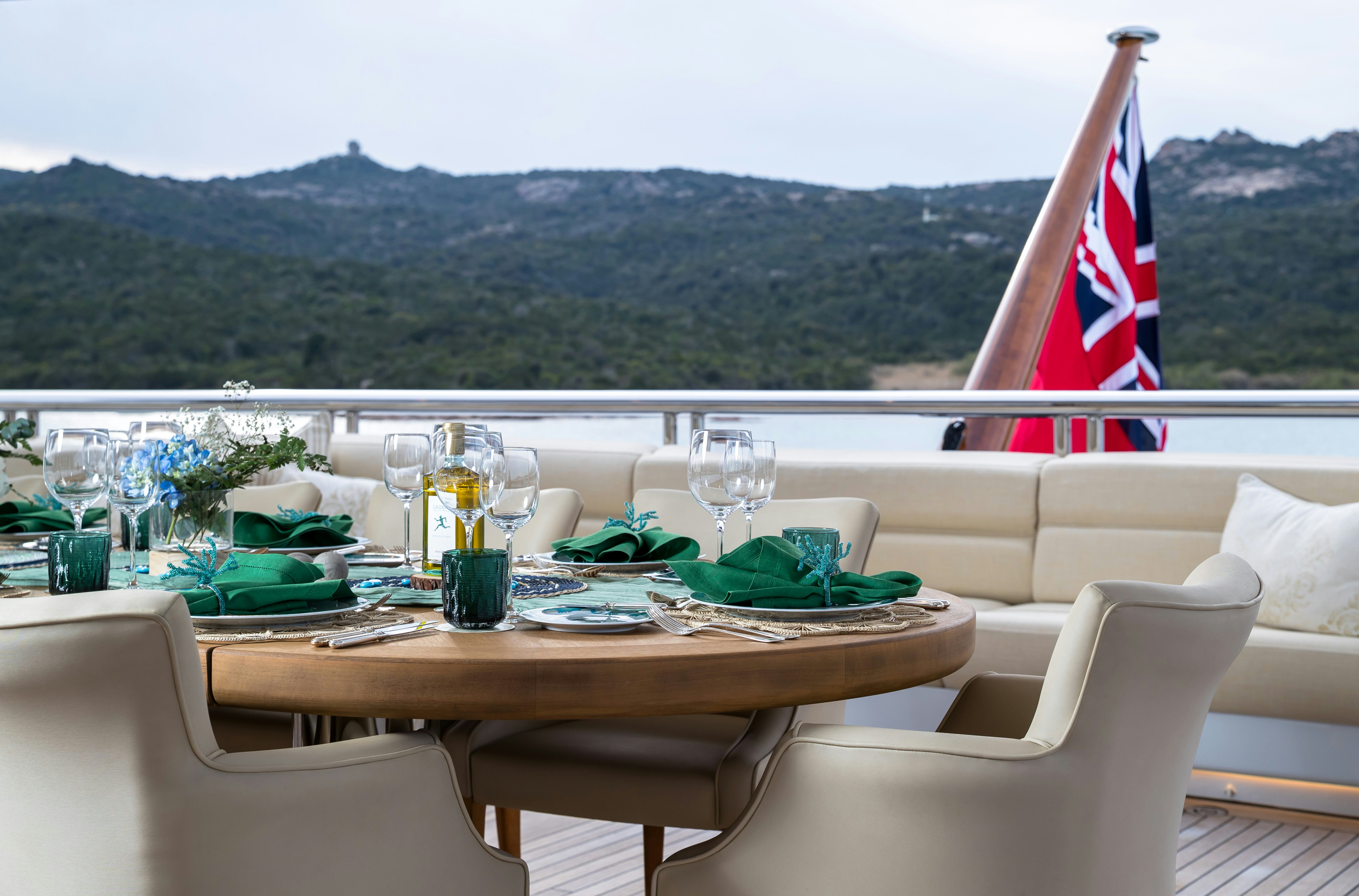 a table with glasses and food on it aboard STARFIRE Yacht for Charter