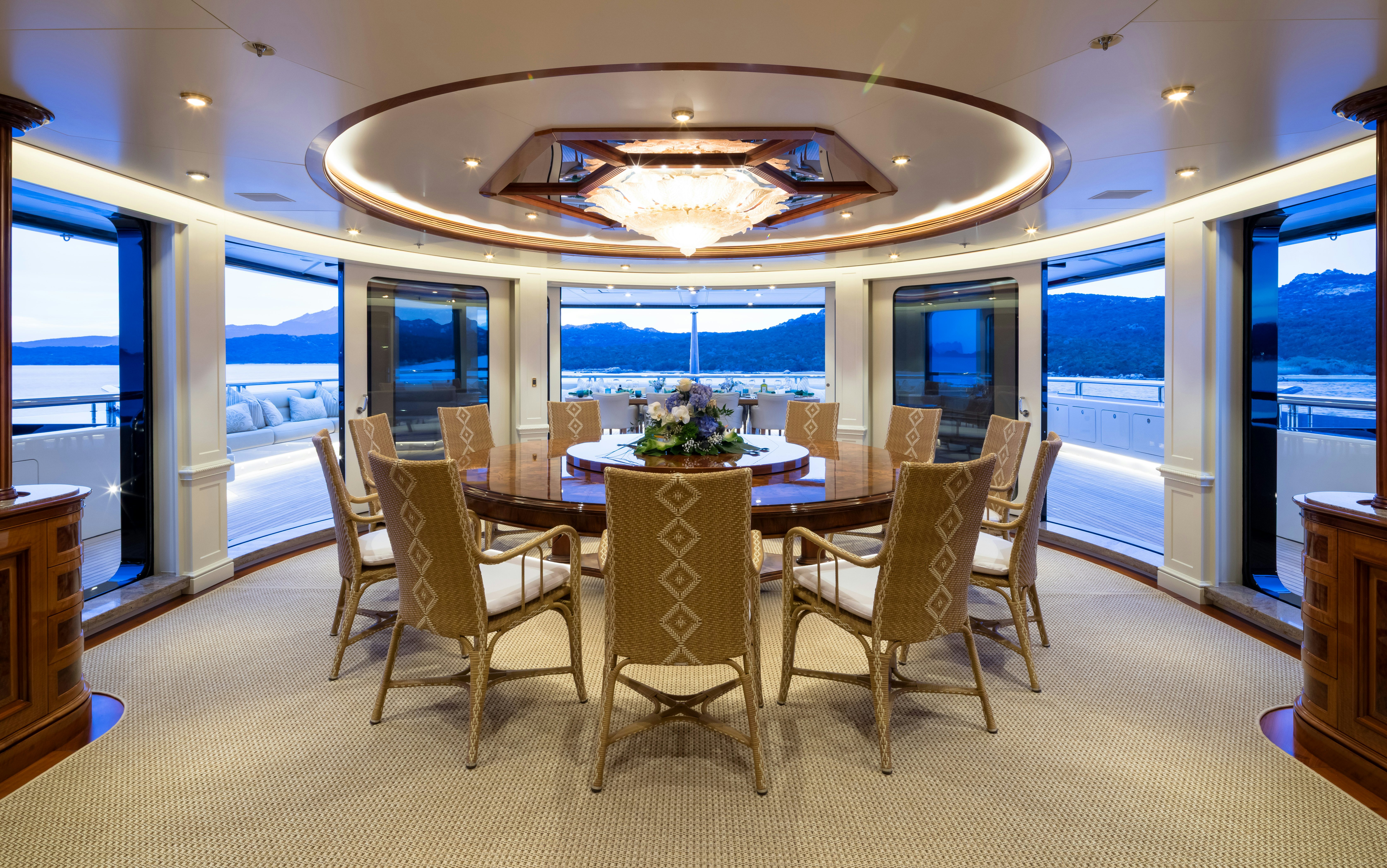 a room with a table and chairs aboard STARFIRE Yacht for Charter