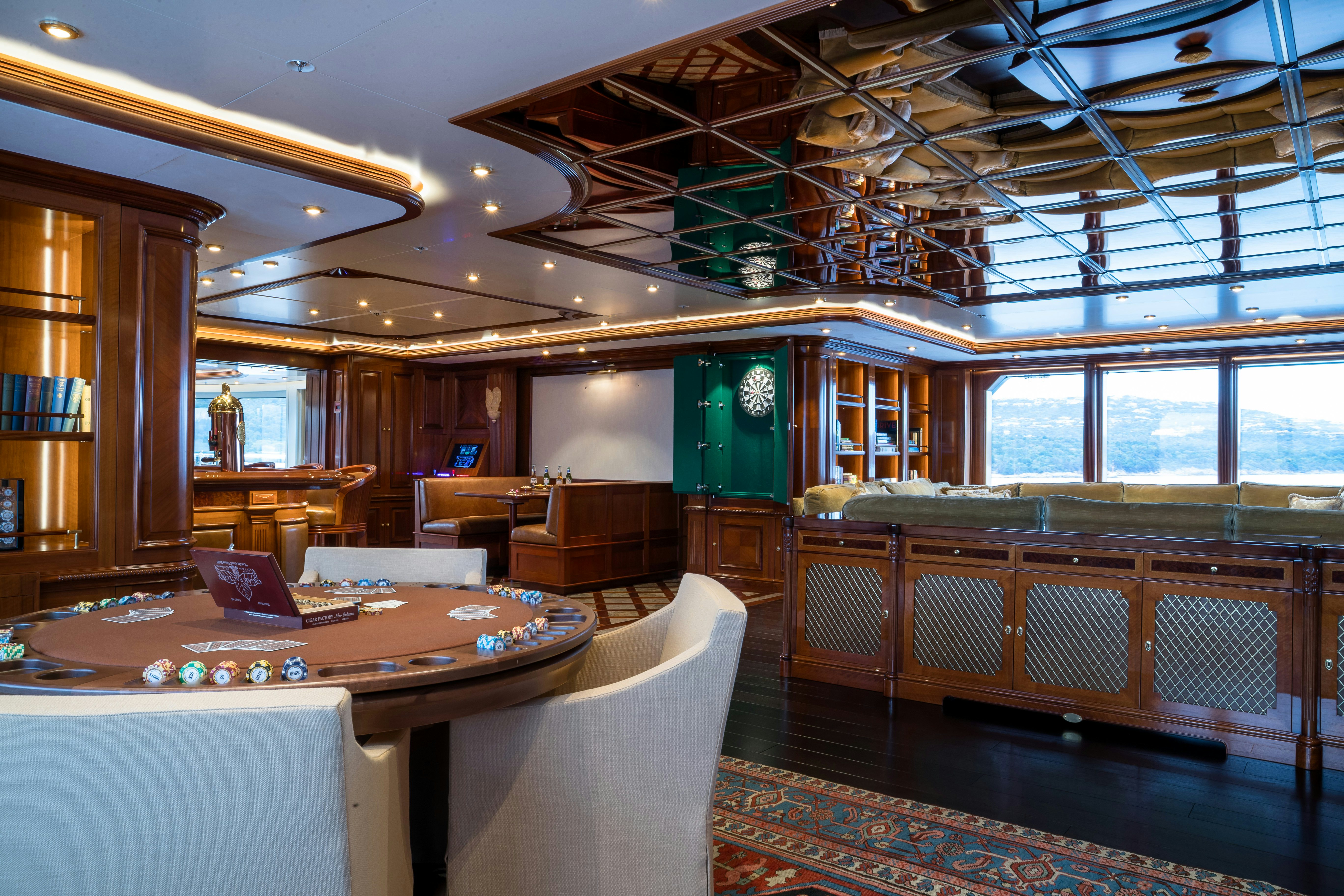 a room with a table and chairs aboard STARFIRE Yacht for Charter