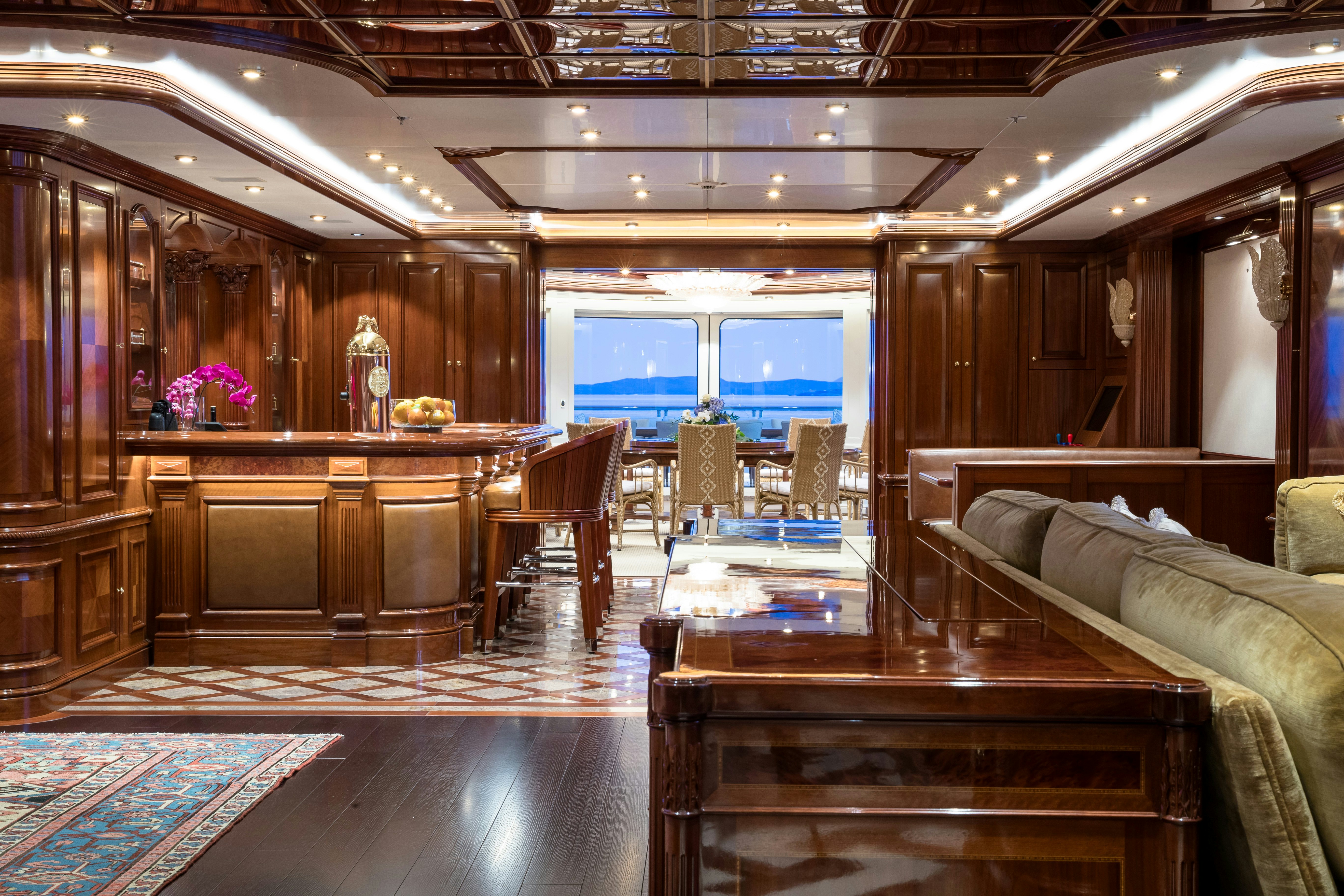 a room with a couch and a table aboard STARFIRE Yacht for Charter