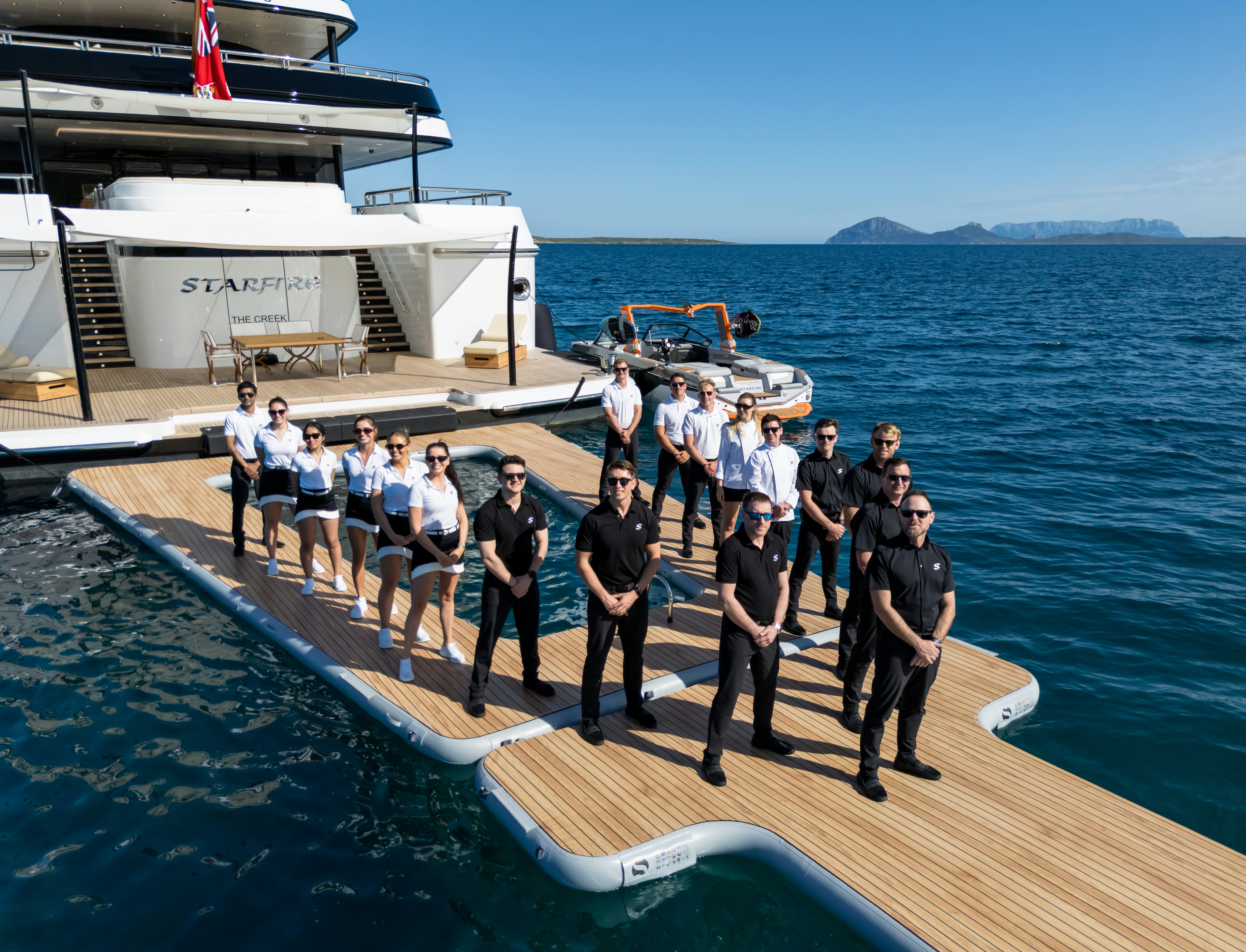 a group of people on a boat aboard STARFIRE Yacht for Charter