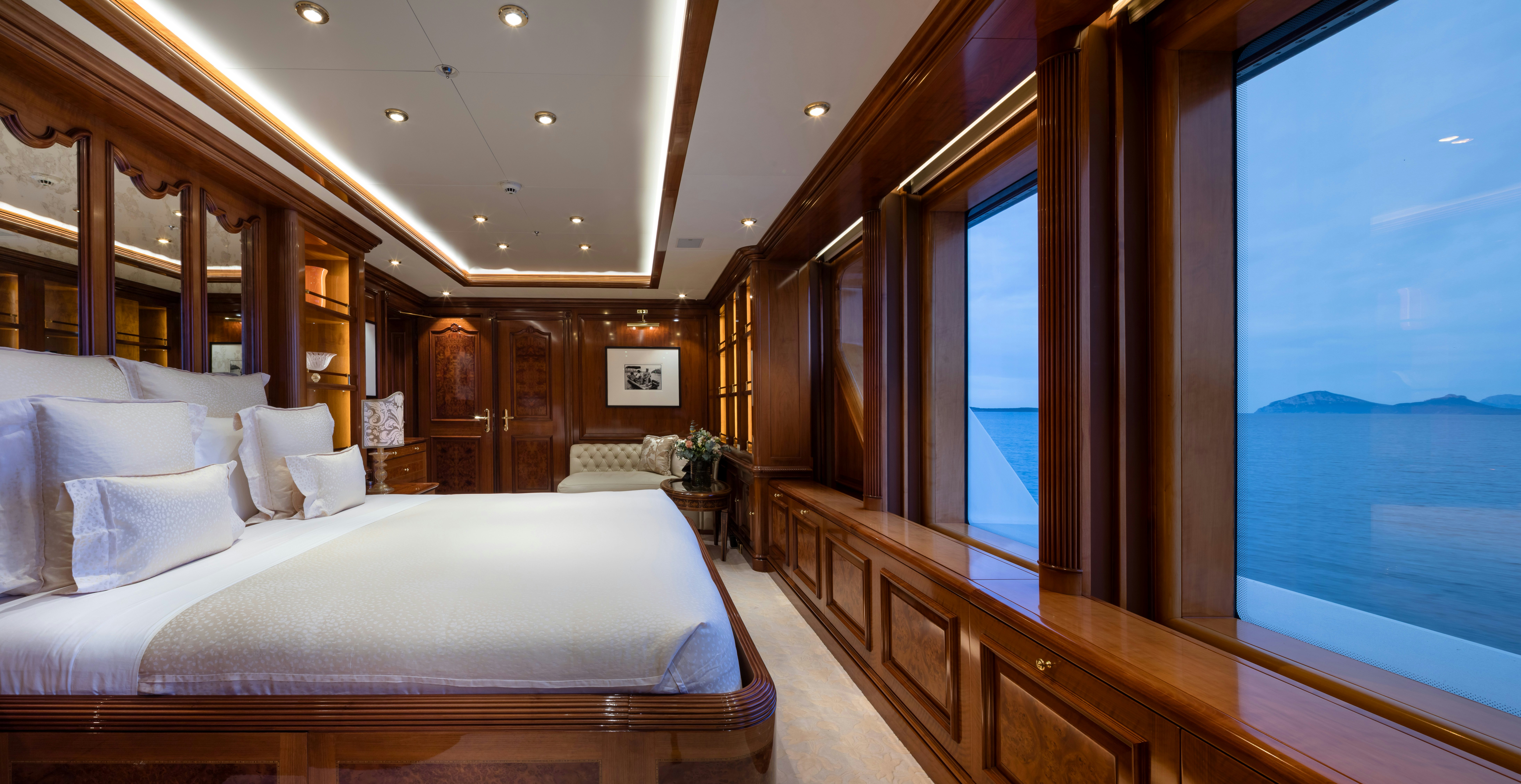a room with a bed and a window aboard STARFIRE Yacht for Charter