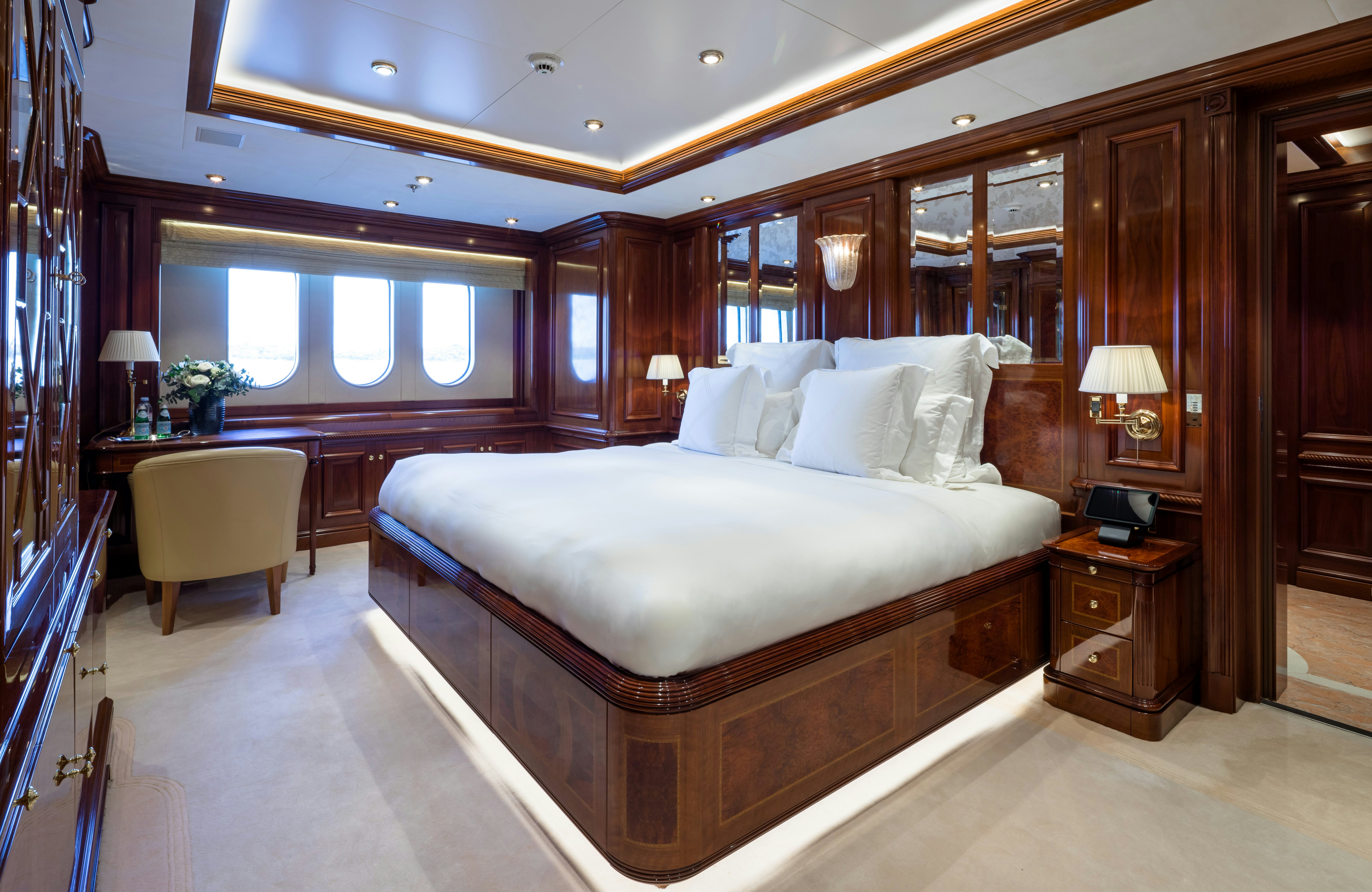 a large bedroom with a large bed aboard STARFIRE Yacht for Charter