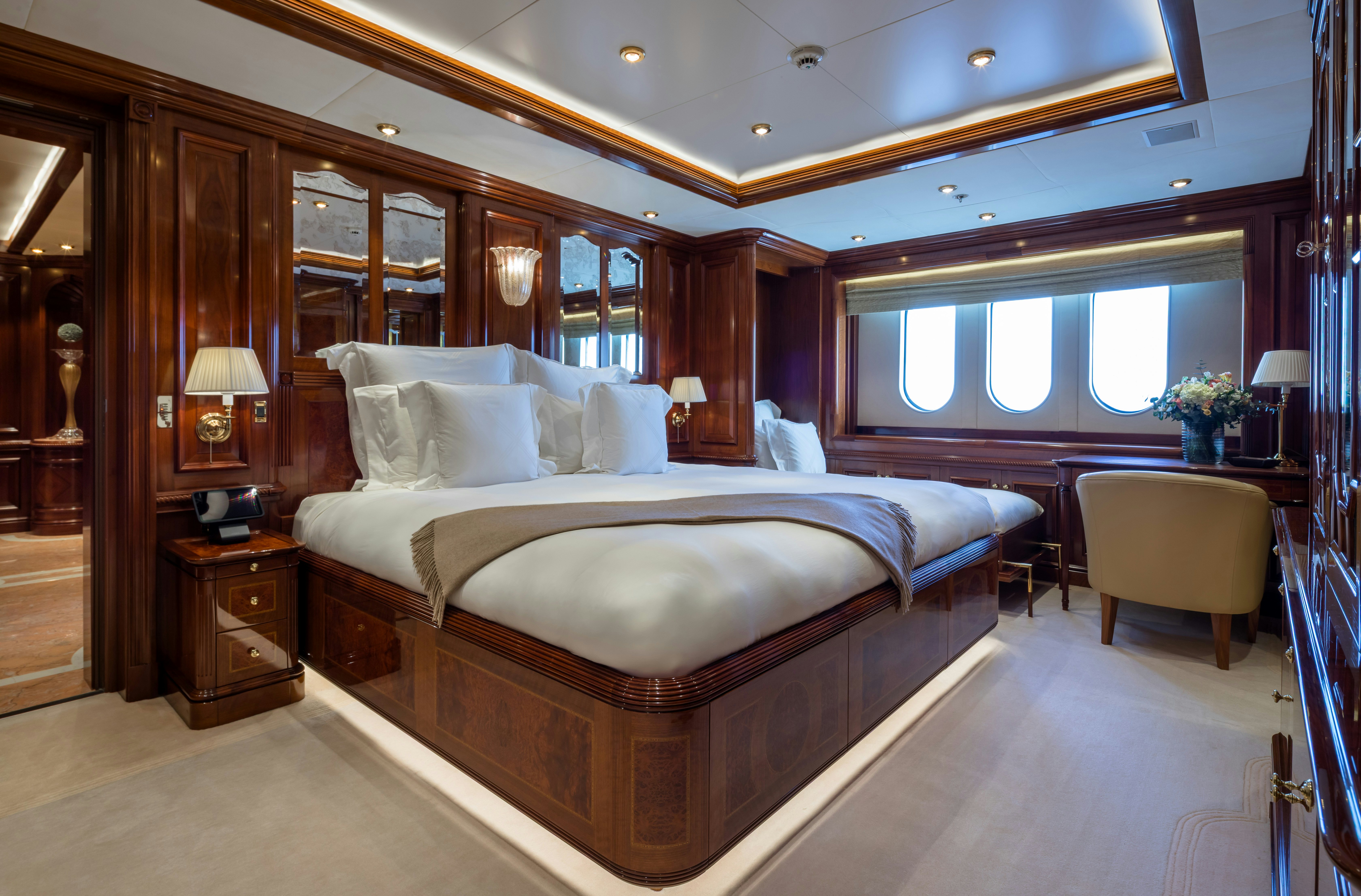 a large bedroom with a large bed aboard STARFIRE Yacht for Charter