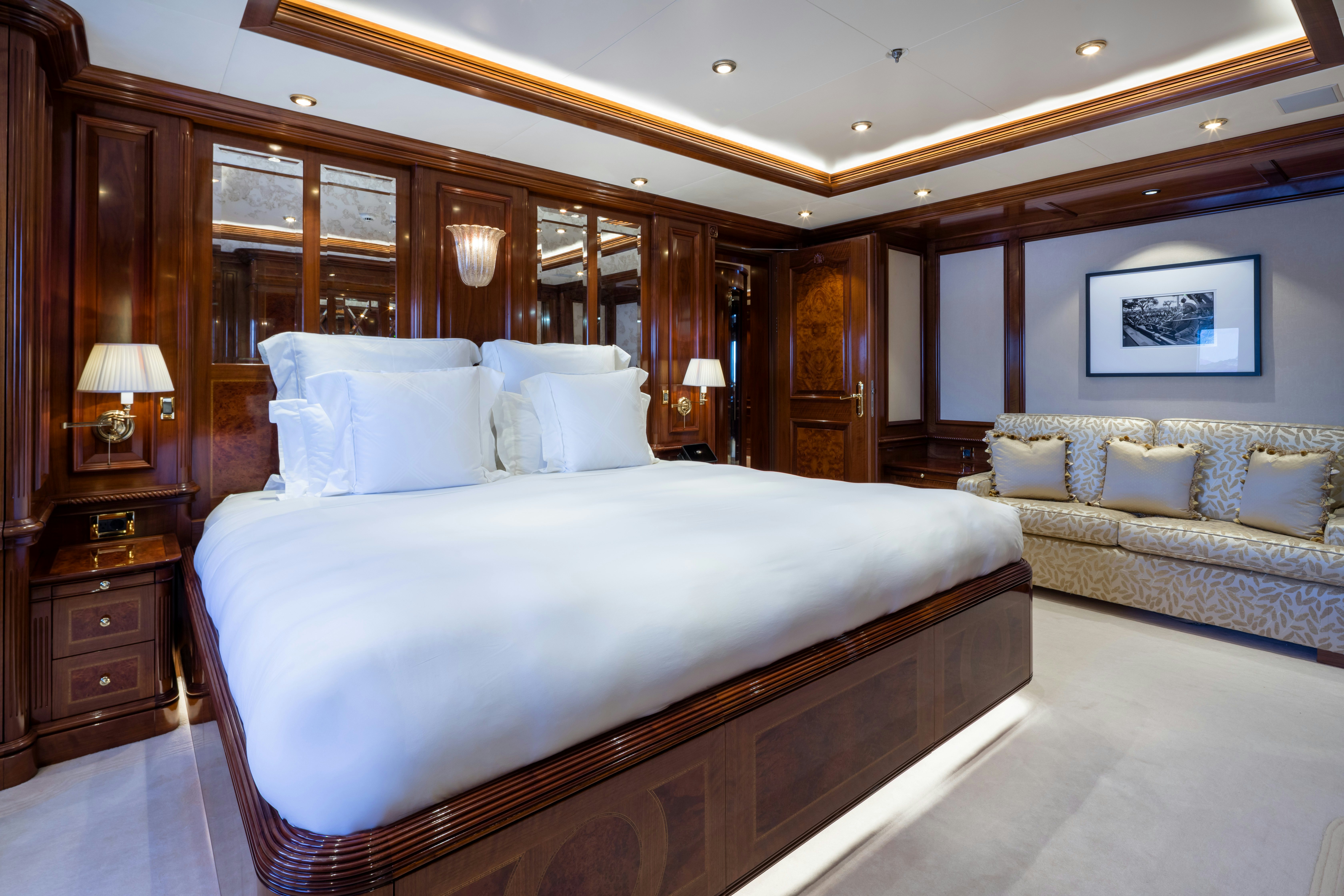 a large bed in a hotel room aboard STARFIRE Yacht for Charter