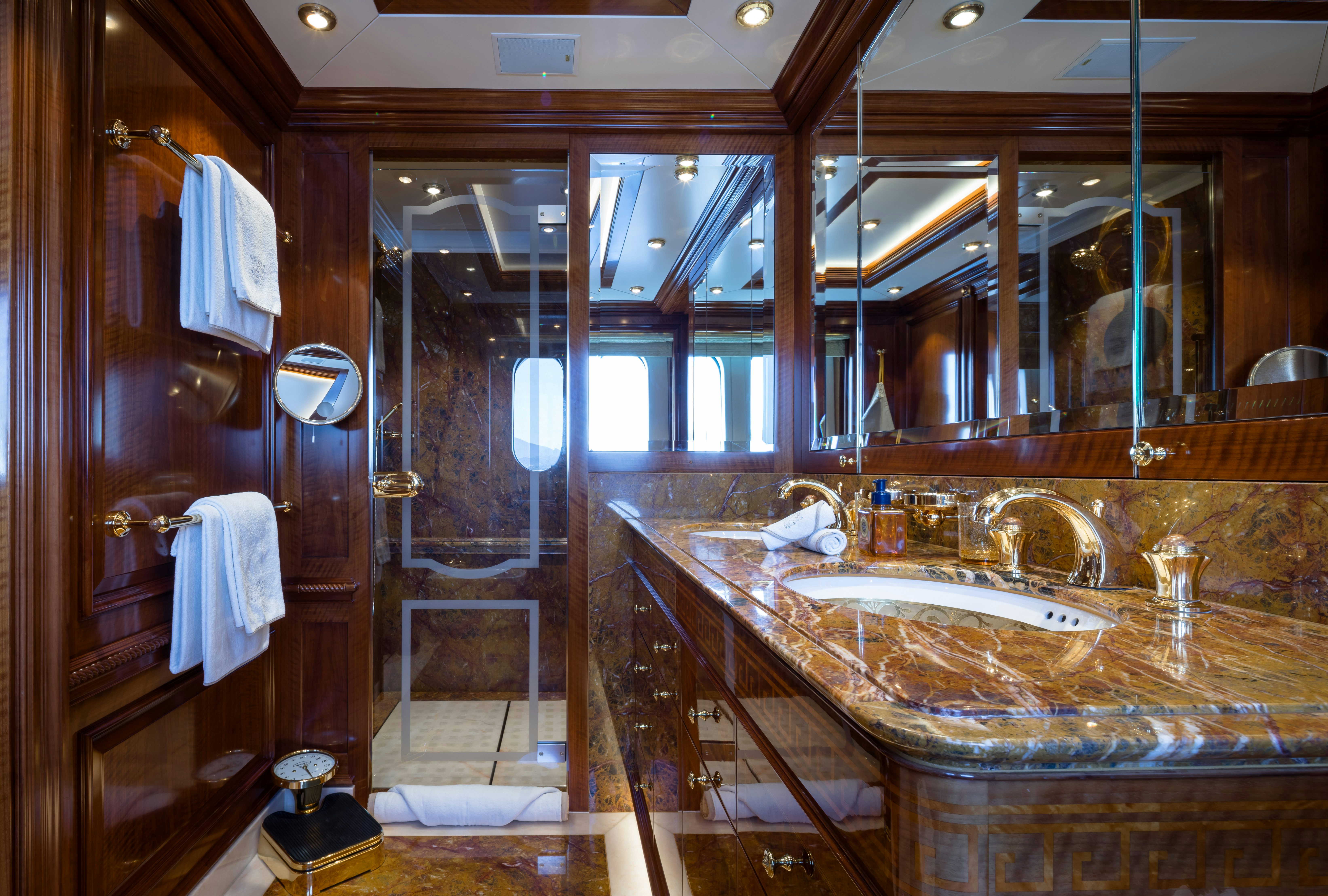 a bathroom with a large mirror aboard STARFIRE Yacht for Charter