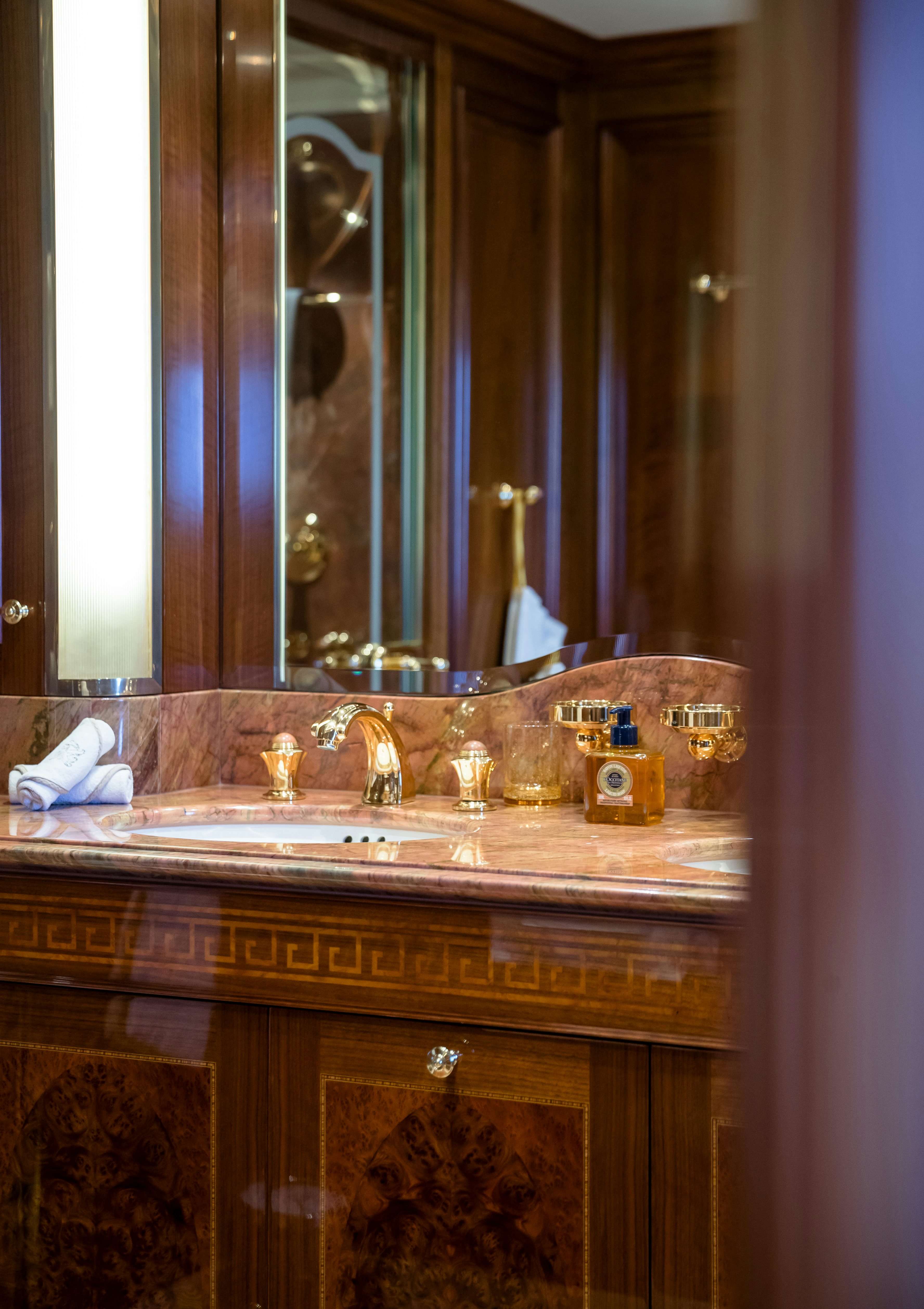 a bathroom with a large mirror aboard STARFIRE Yacht for Charter