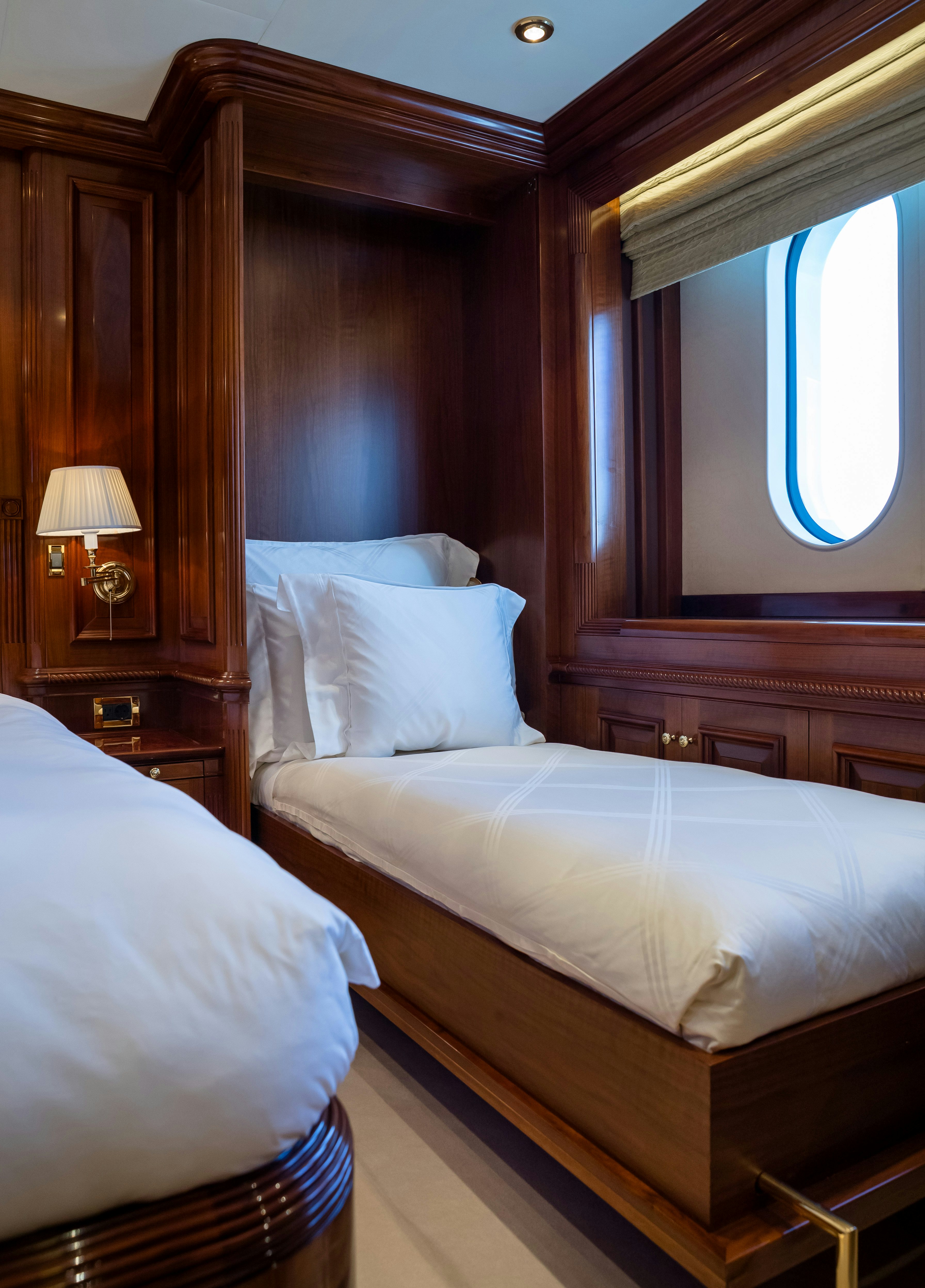 a couple of beds in a room aboard STARFIRE Yacht for Charter