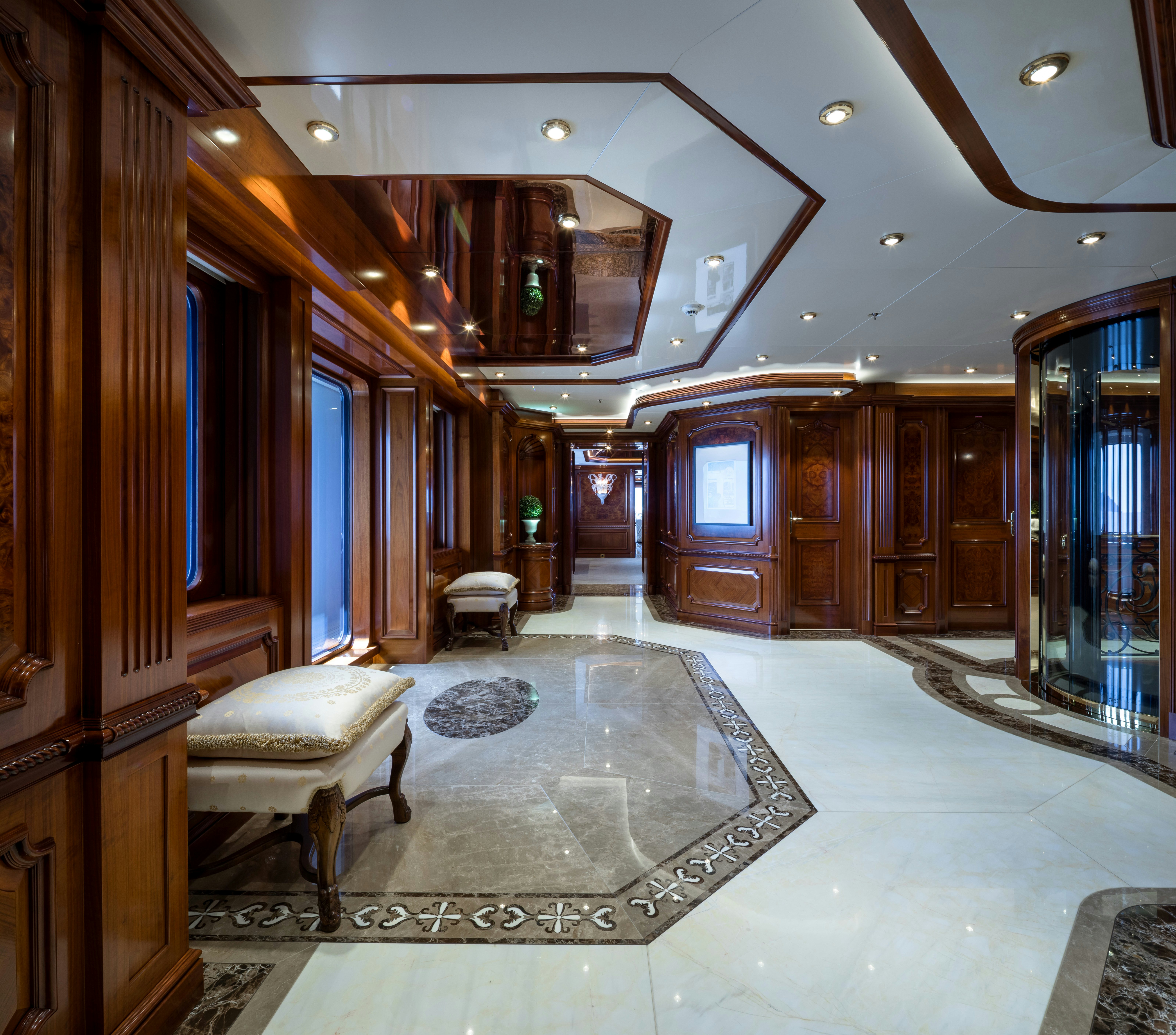 a room with a large mirror and a bench aboard STARFIRE Yacht for Charter