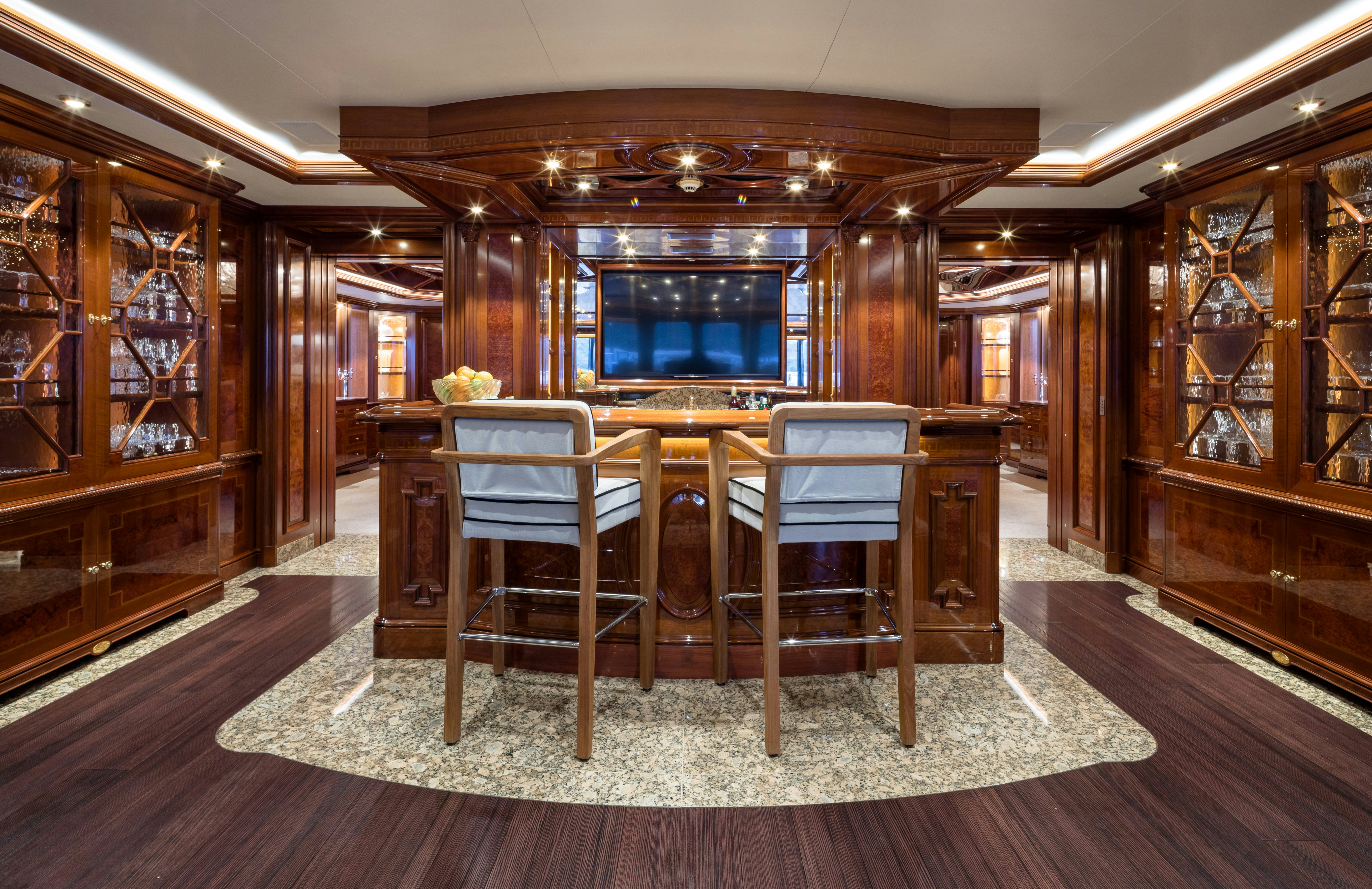 a room with a table and chairs aboard STARFIRE Yacht for Charter