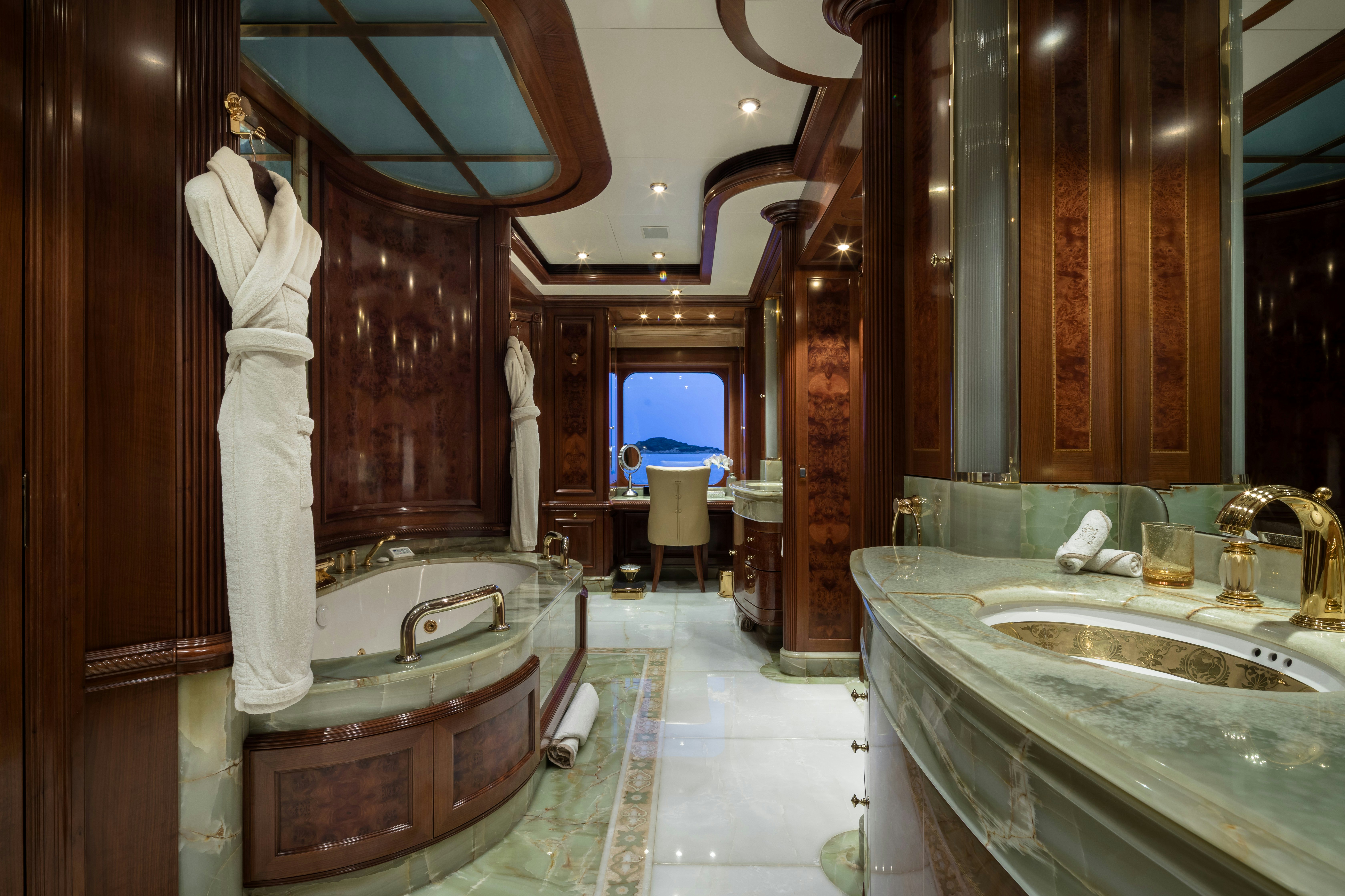 a fancy bathroom with a large bathtub aboard STARFIRE Yacht for Charter