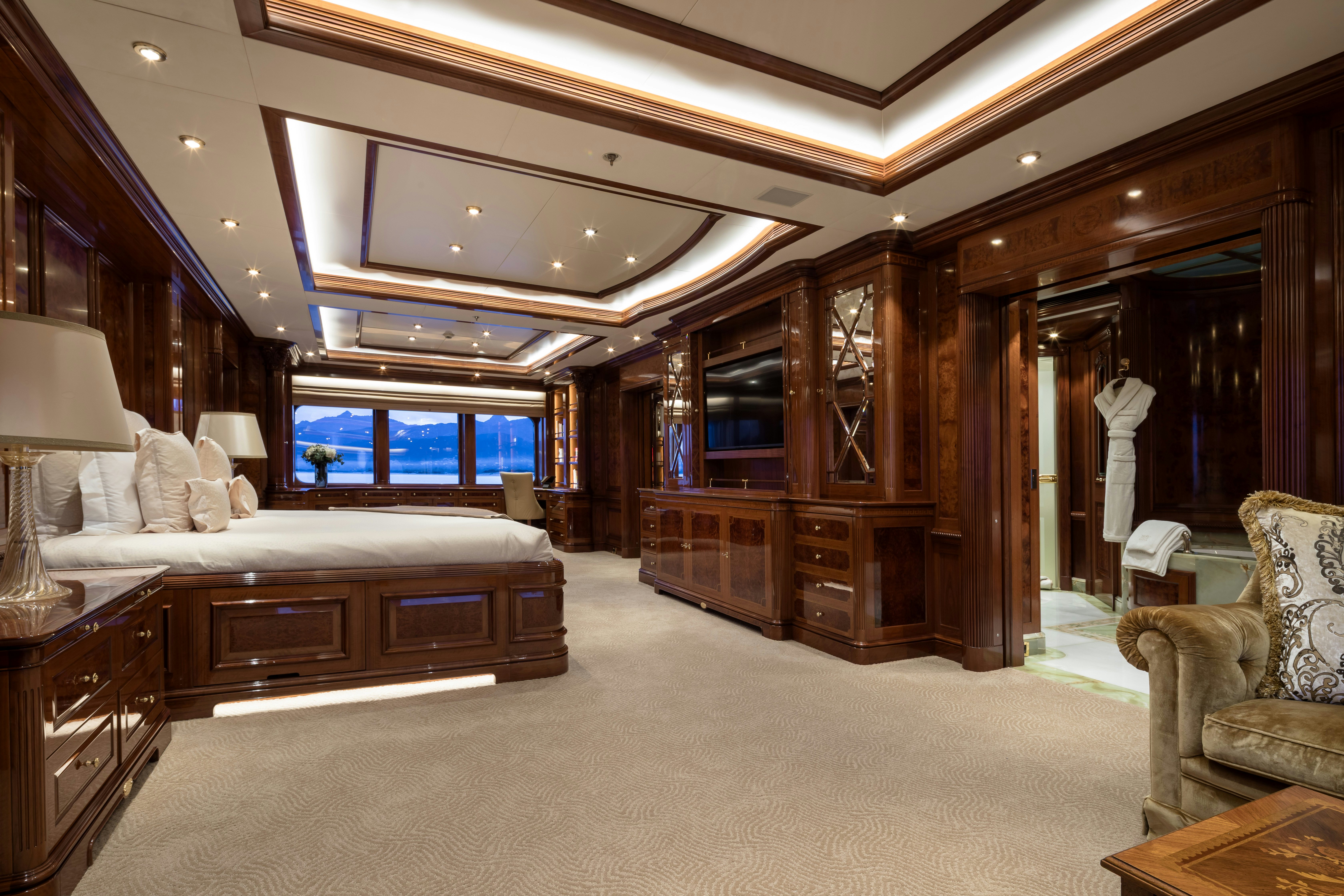 a large bedroom with a large bed aboard STARFIRE Yacht for Charter