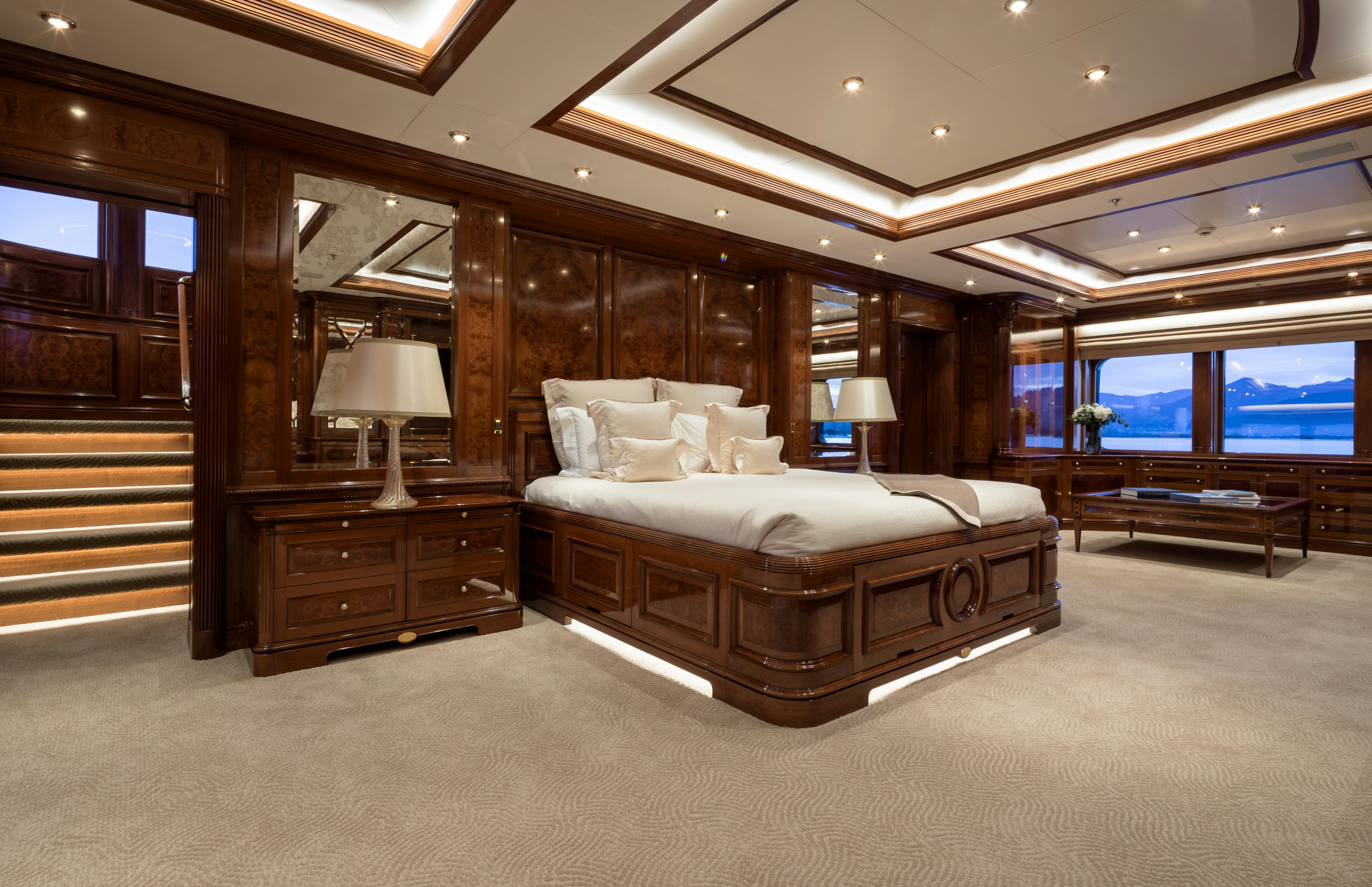 a large bedroom with a large bed aboard STARFIRE Yacht for Charter