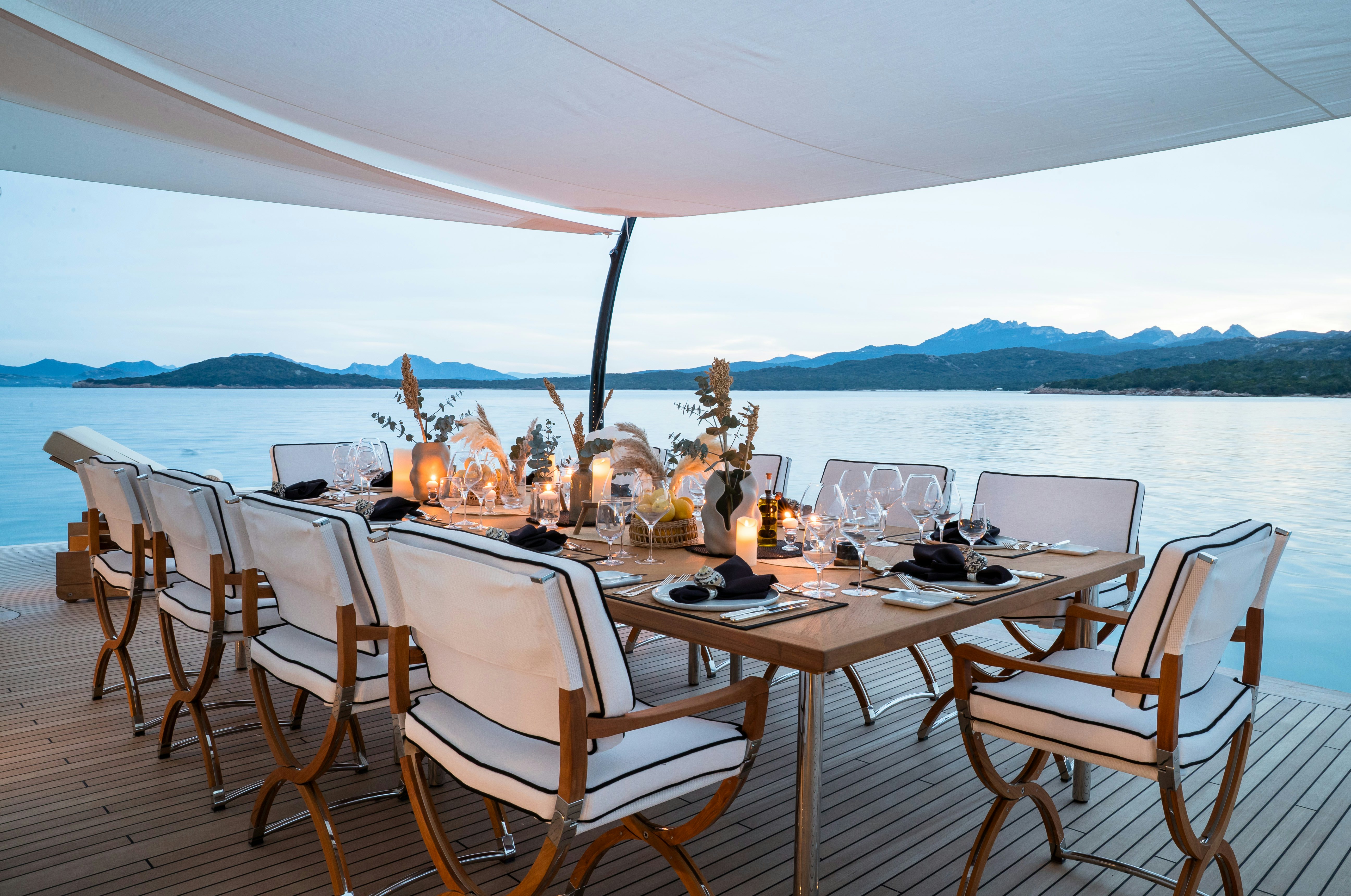 a table set for a meal on a boat aboard STARFIRE Yacht for Charter