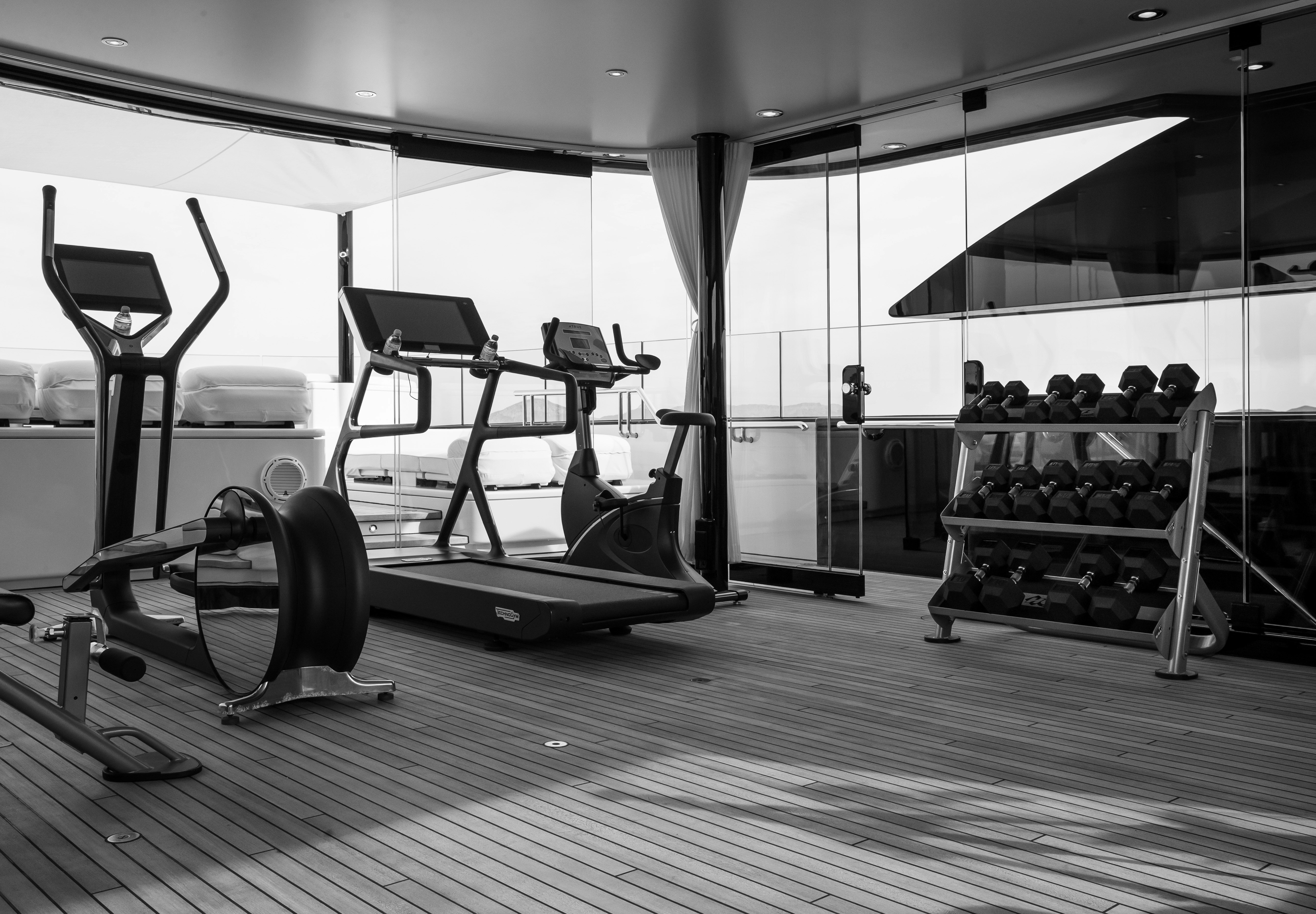 a gym with exercise equipment aboard STARFIRE Yacht for Charter