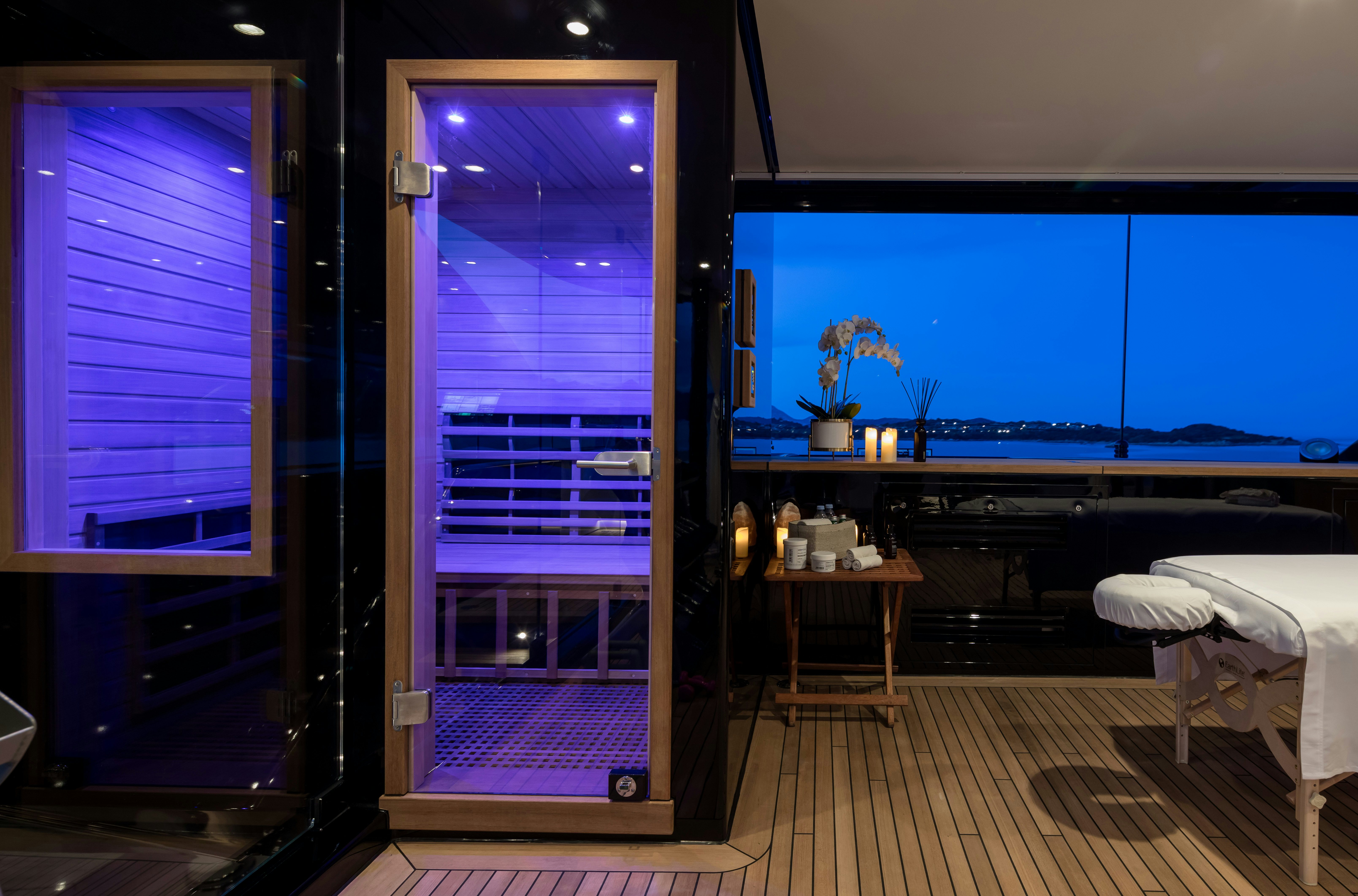 a room with a bed and a window aboard STARFIRE Yacht for Charter