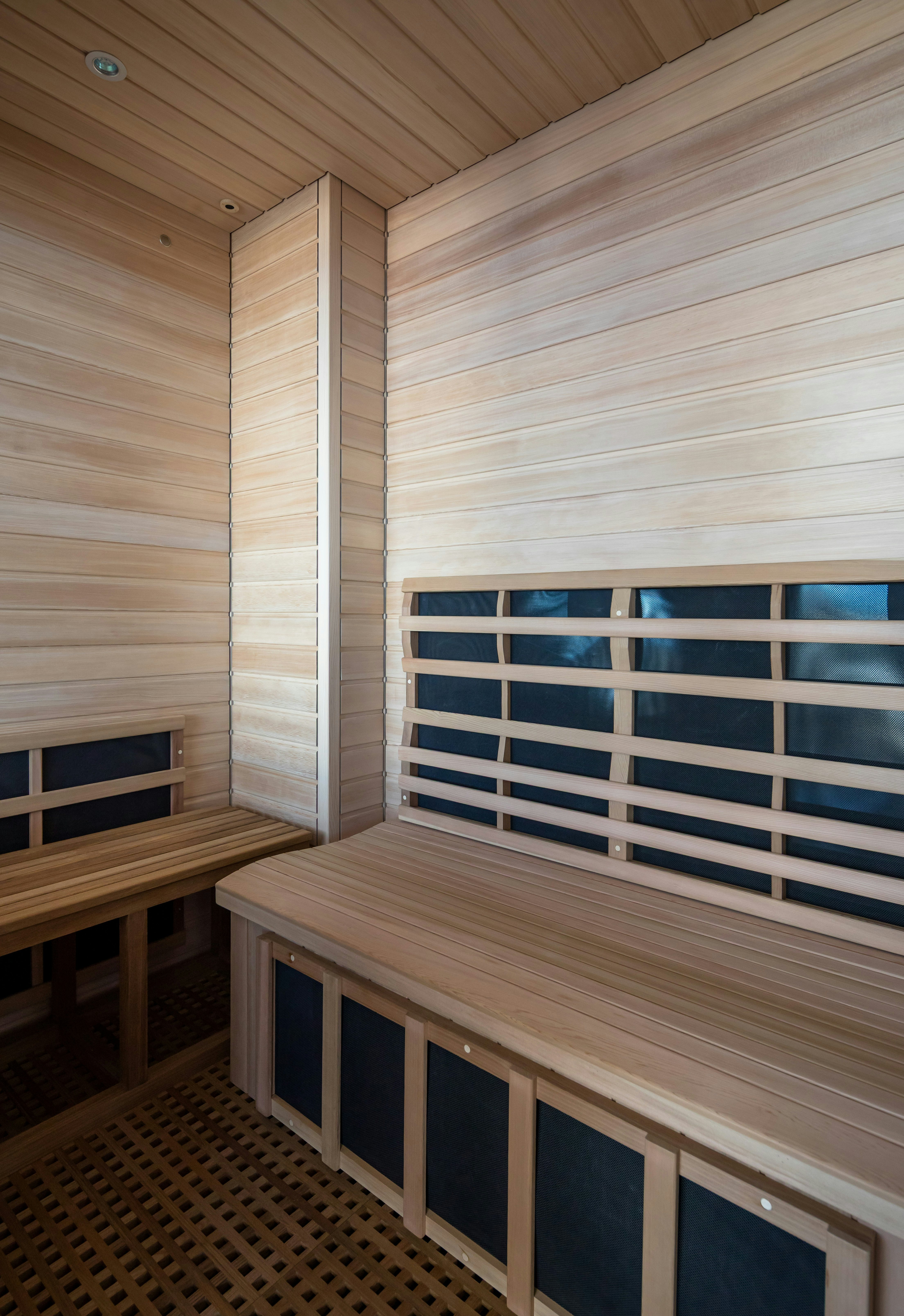a room with wood walls and a bench and a window aboard STARFIRE Yacht for Charter