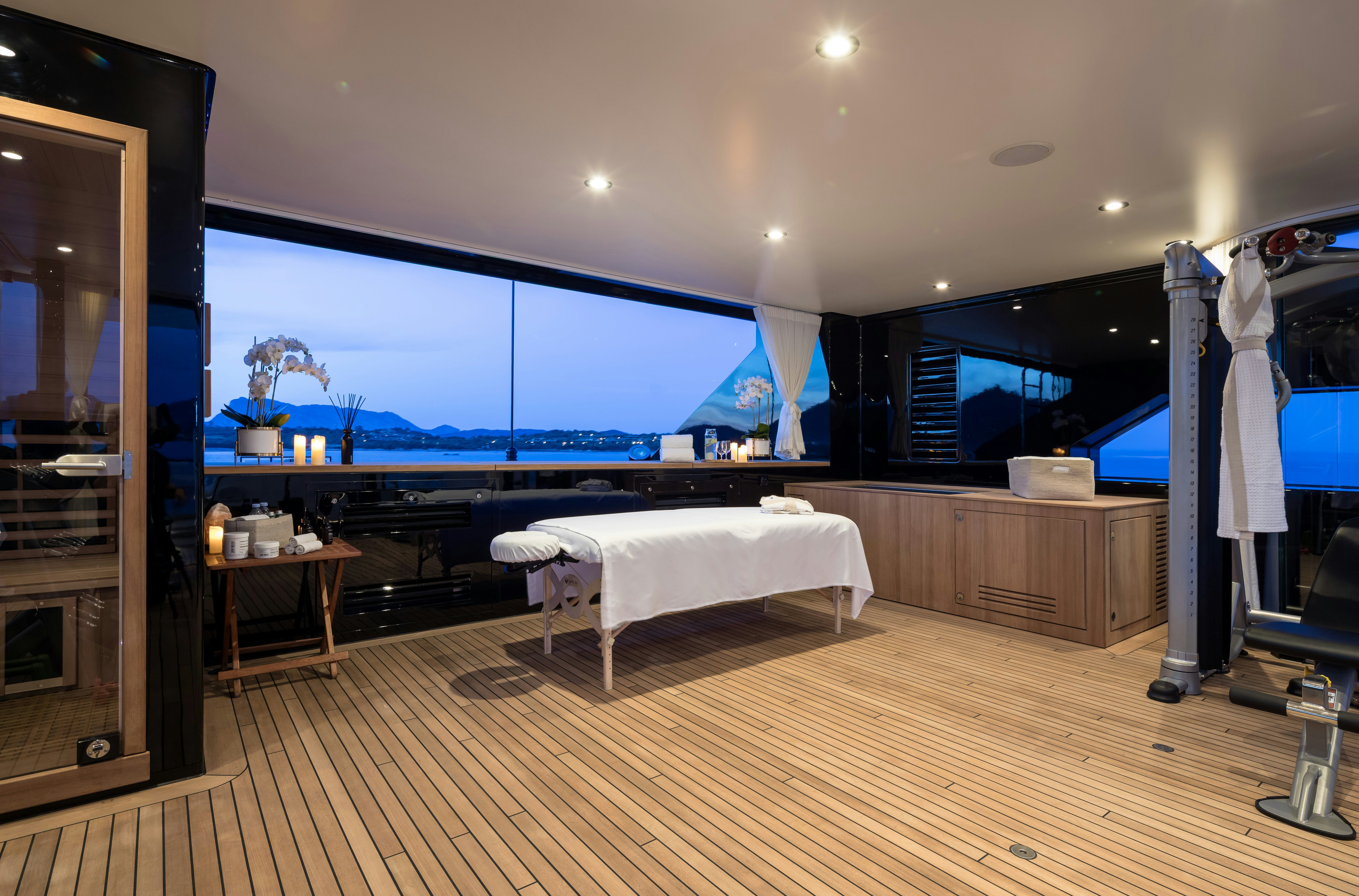 a room with a bed and a large screen aboard STARFIRE Yacht for Charter