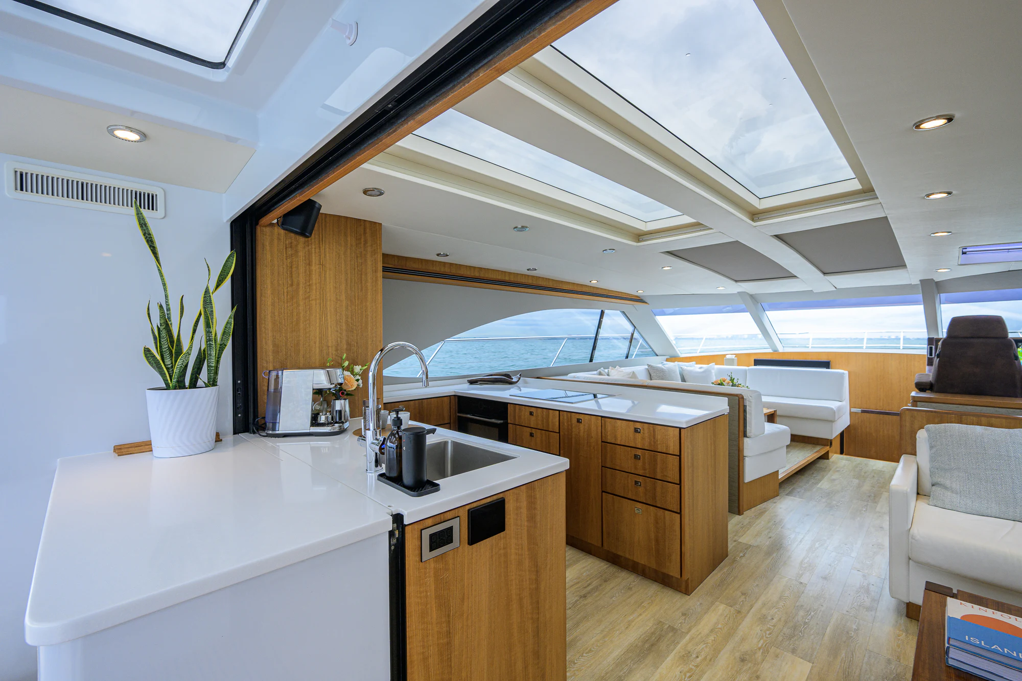 a kitchen with a large window aboard TURQUOISE Yacht for Sale