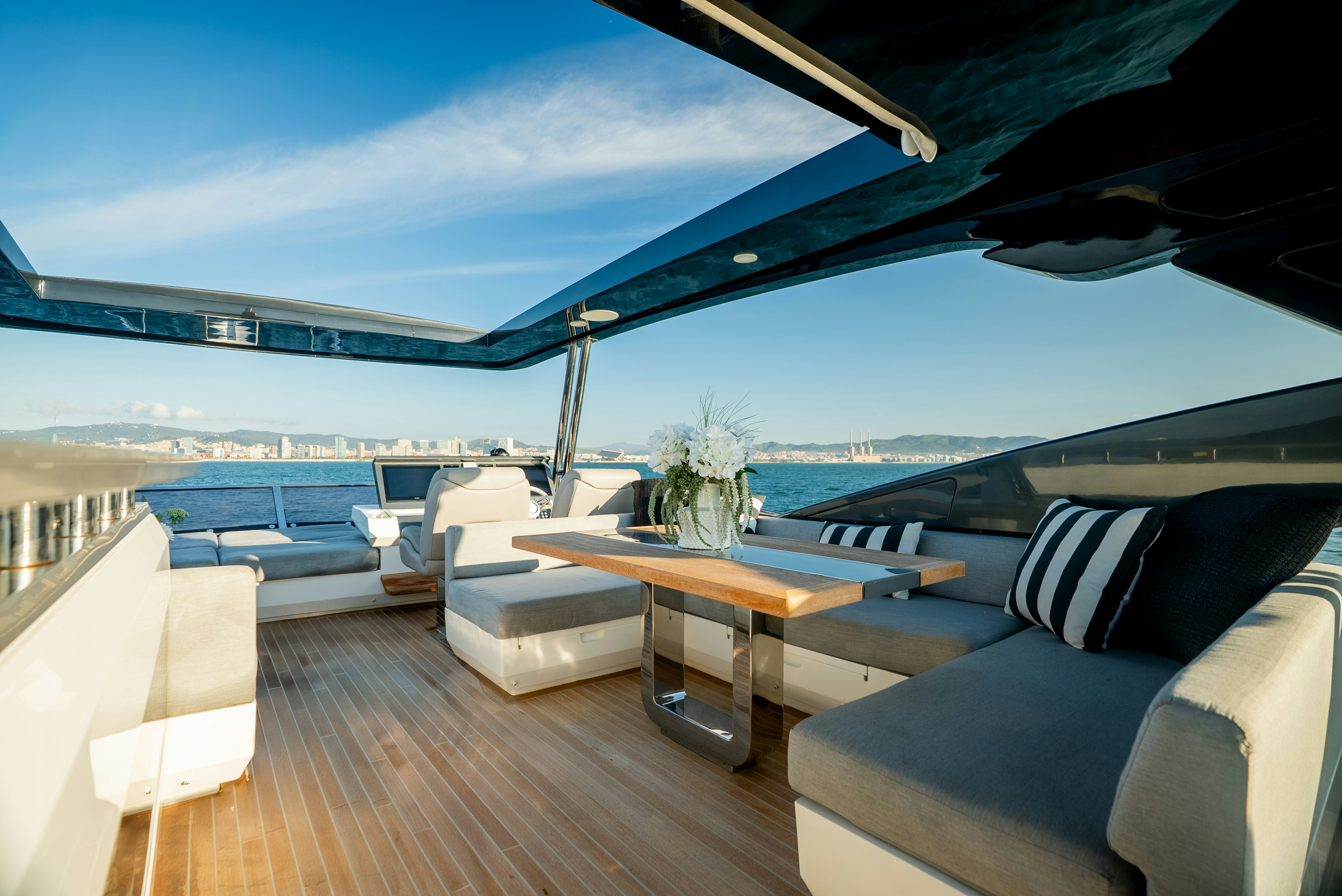 a room with a table and chairs aboard OMNIA Yacht for Sale