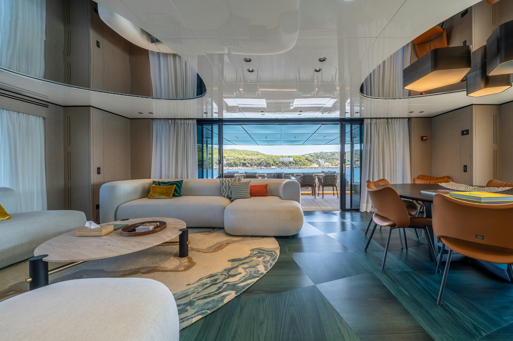 a living room with a large window aboard ACALI Yacht for Sale