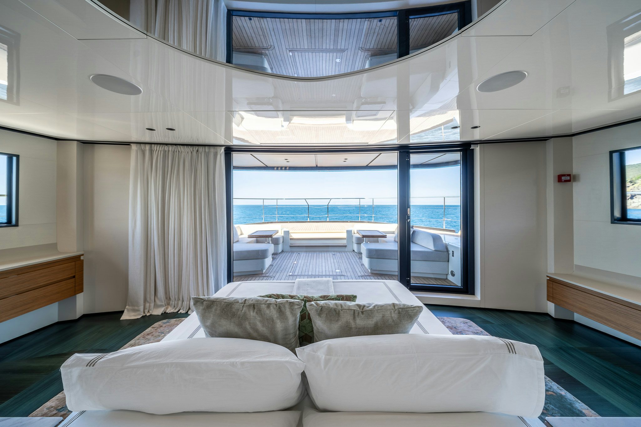 a room with a couch and a large window aboard ACALI Yacht for Sale