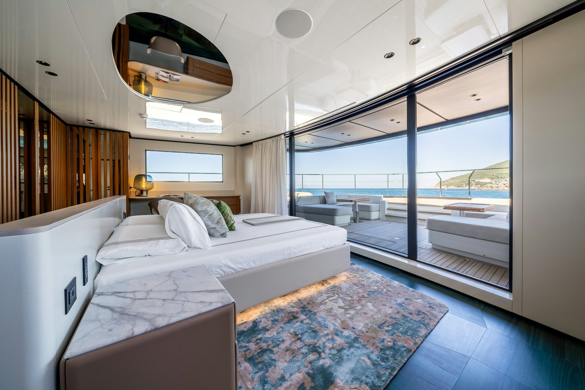 a room with a bed and a window aboard ACALI Yacht for Sale
