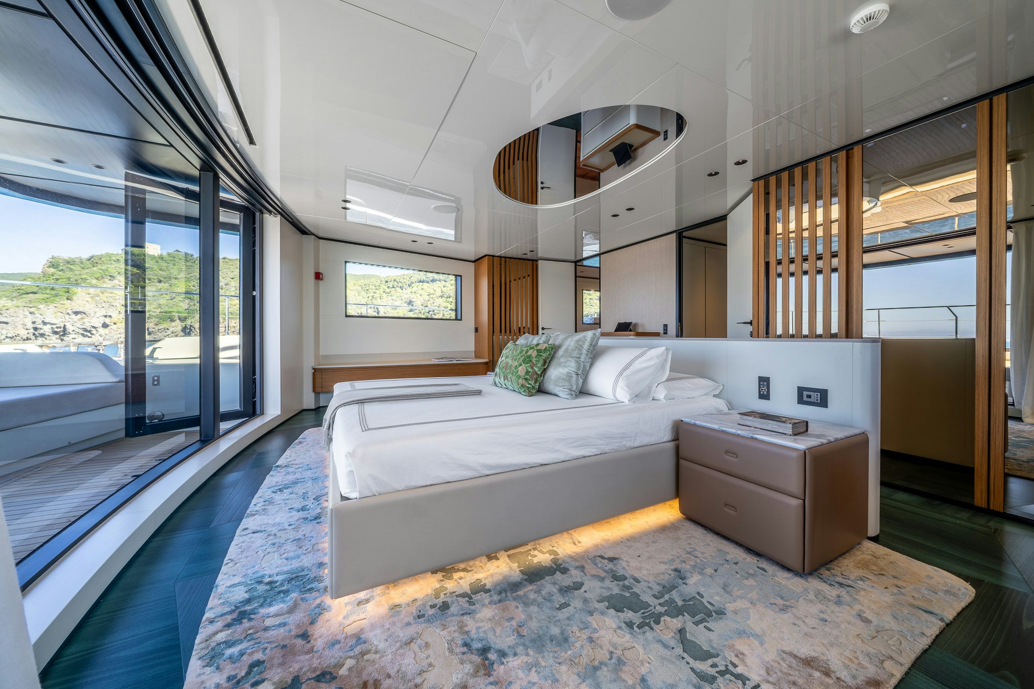 a bedroom with a large bed aboard ACALI Yacht for Sale
