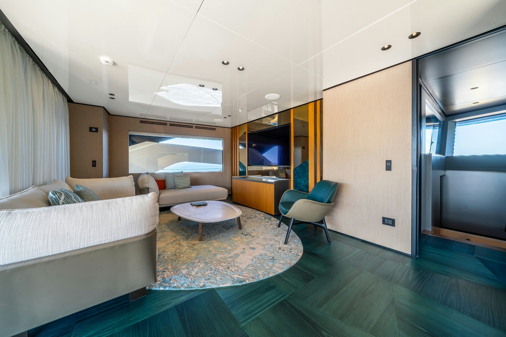 a living room with a couch and a table aboard ACALI Yacht for Sale