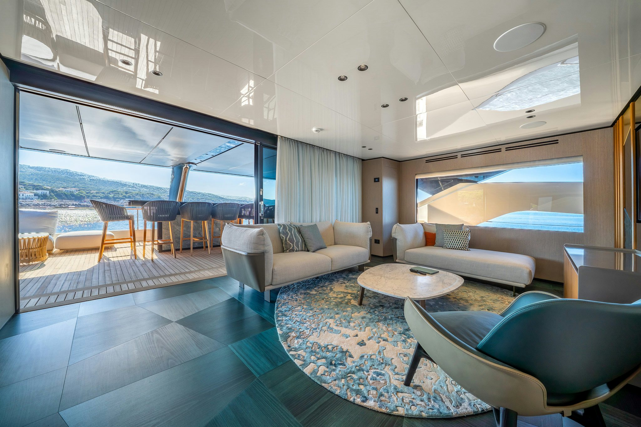 a living room with a large window aboard ACALI Yacht for Sale
