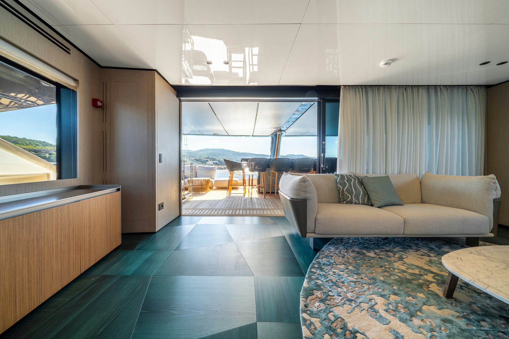 a living room with a large window aboard ACALI Yacht for Sale