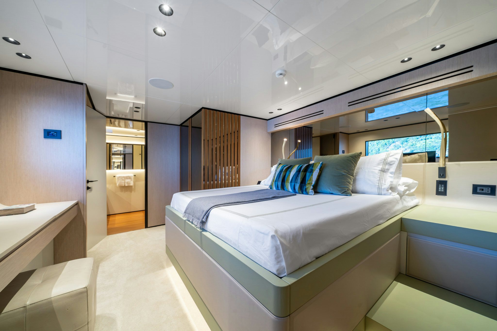 a room with a bed and a desk aboard ACALI Yacht for Sale