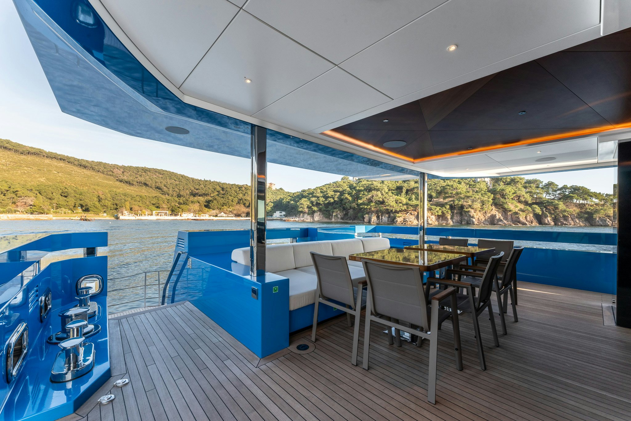 a table and chairs on a deck aboard MERELEY I Yacht for Sale