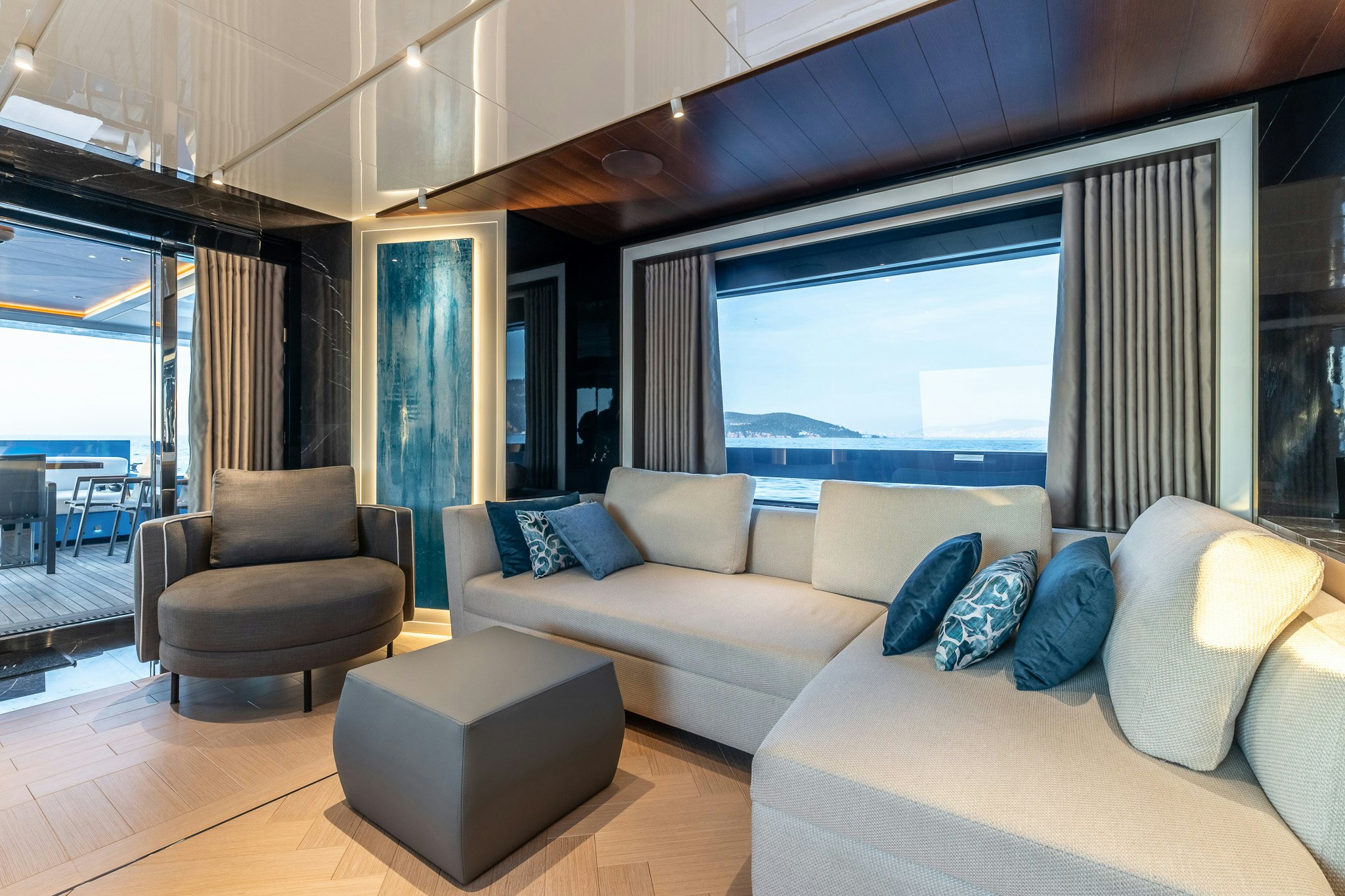 a living room with a large window aboard MERELEY I Yacht for Sale