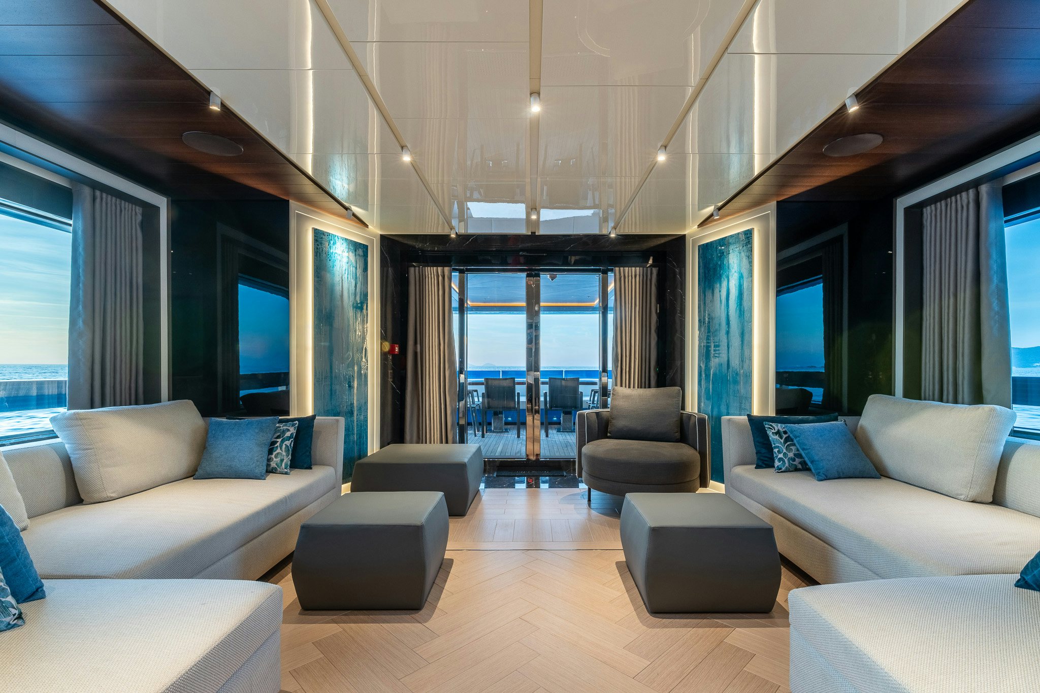 a living room with a large window aboard MERELEY I Yacht for Sale