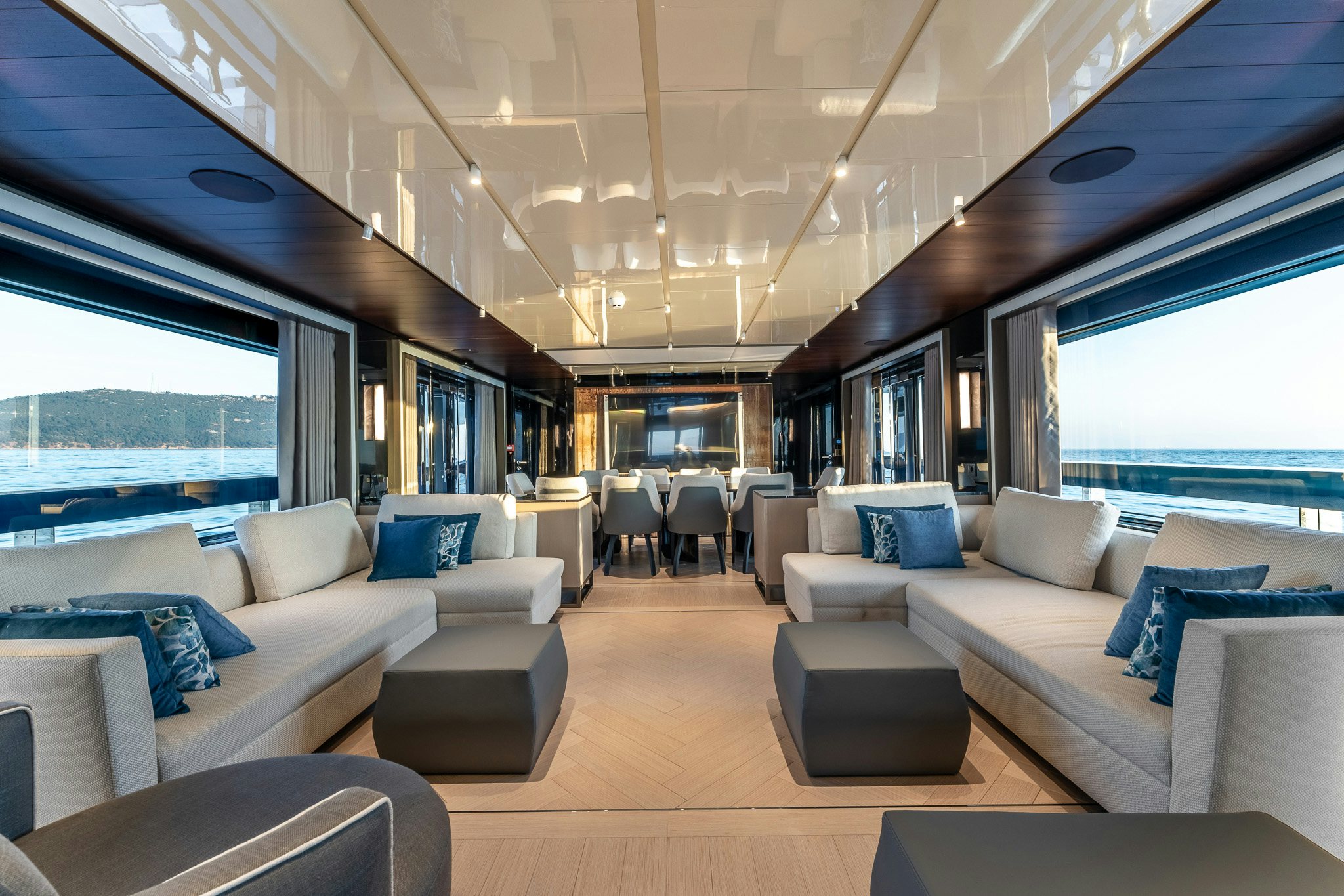 a living room with a large window aboard MERELEY I Yacht for Sale