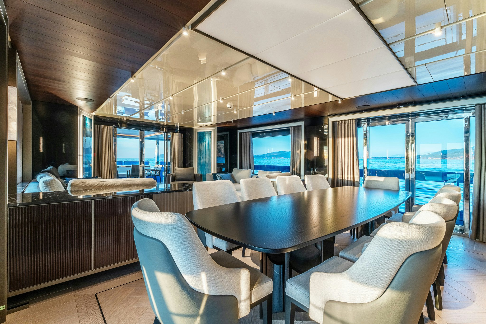 a room with a table chairs and a large window aboard MERELEY I Yacht for Sale