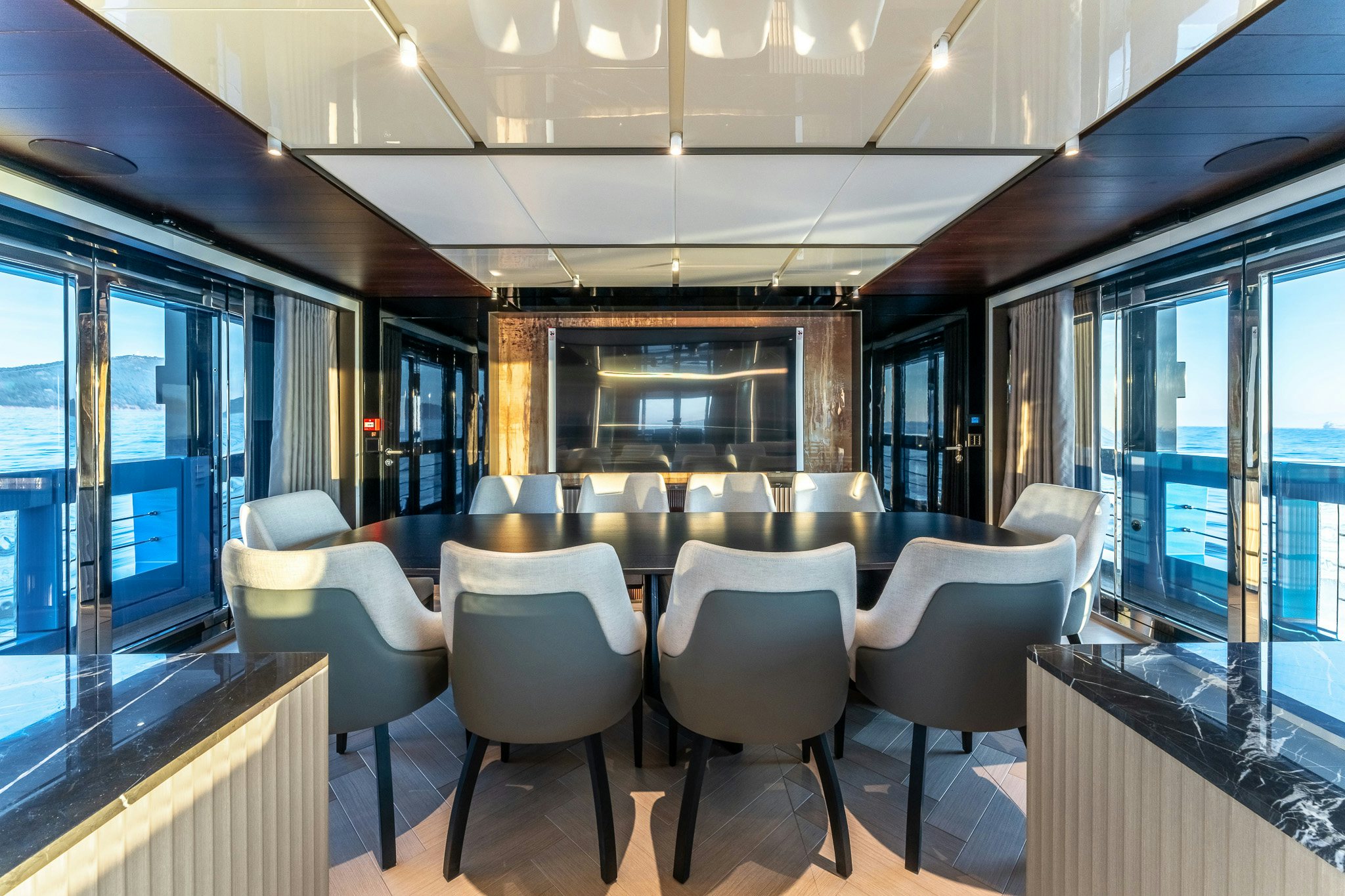 a room with a table chairs and a large window aboard MERELEY I Yacht for Sale