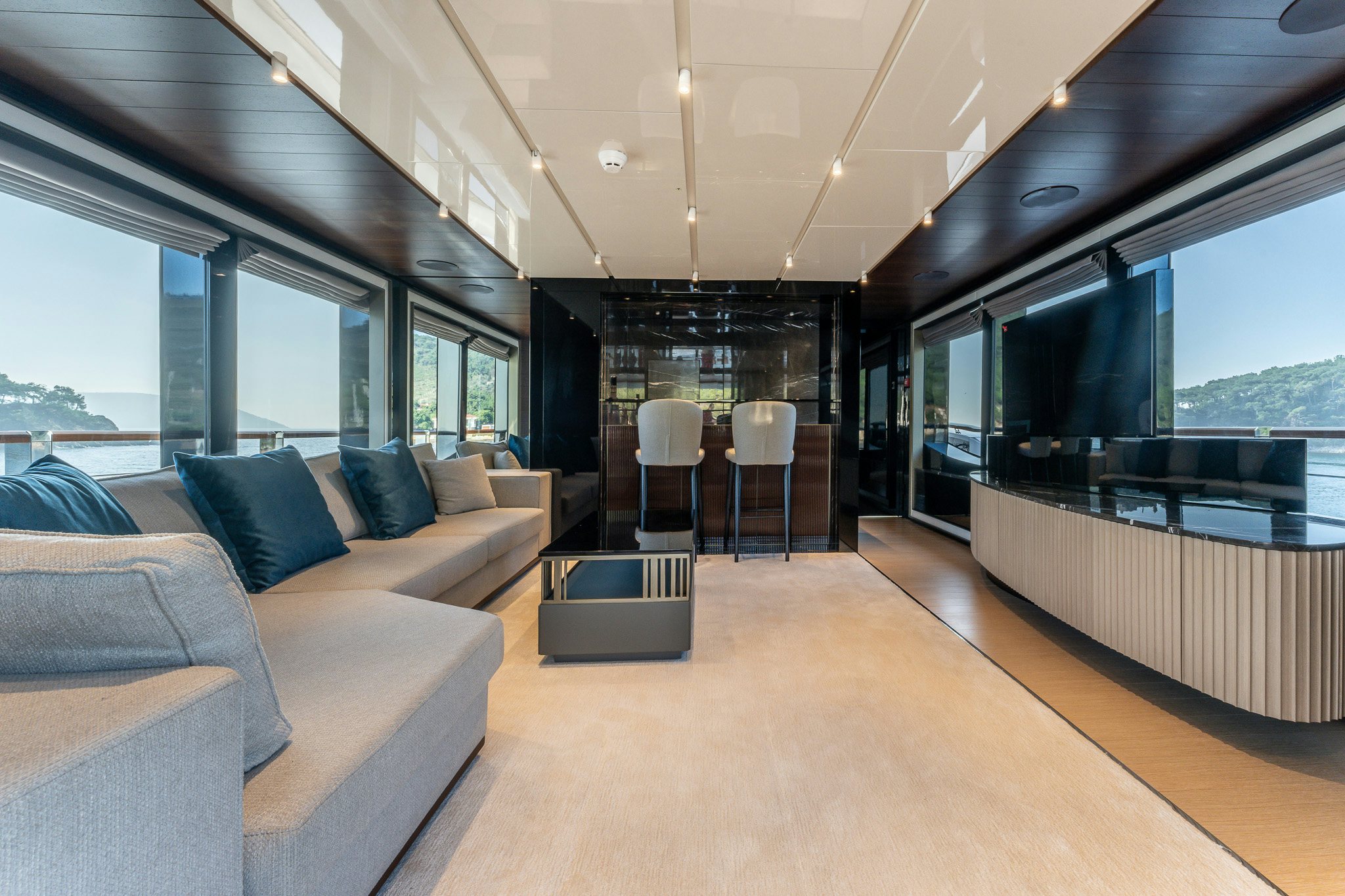 a living room with a large glass window aboard MERELEY I Yacht for Sale