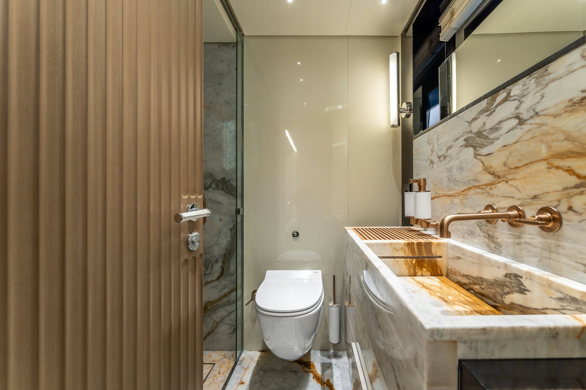 a bathroom with a sink toilet and a bathtub aboard MERELEY I Yacht for Sale