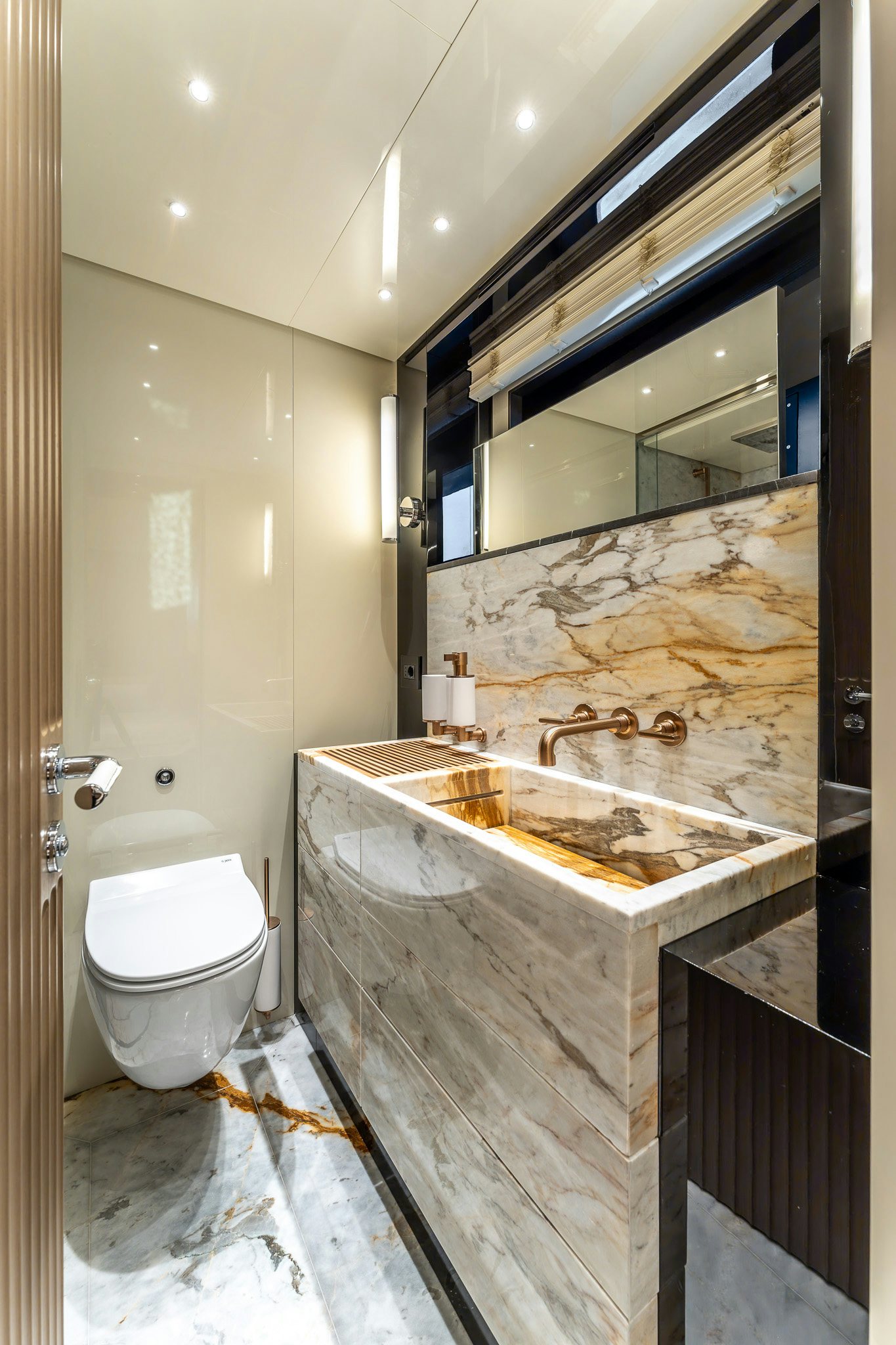 a bathroom with a sink and a toilet aboard MERELEY I Yacht for Sale