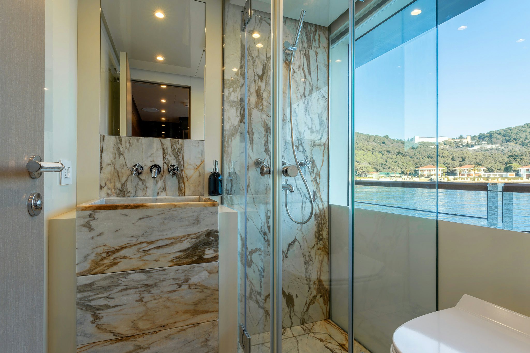 a bathroom with a shower aboard MERELEY I Yacht for Sale
