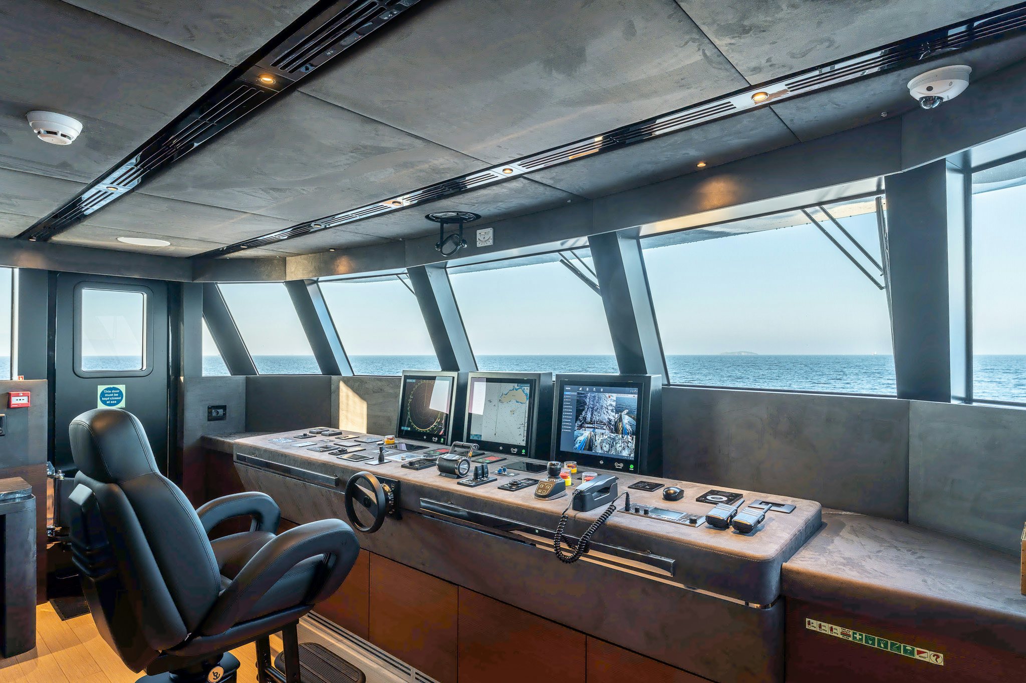 a room with computers and monitors aboard MERELEY I Yacht for Sale