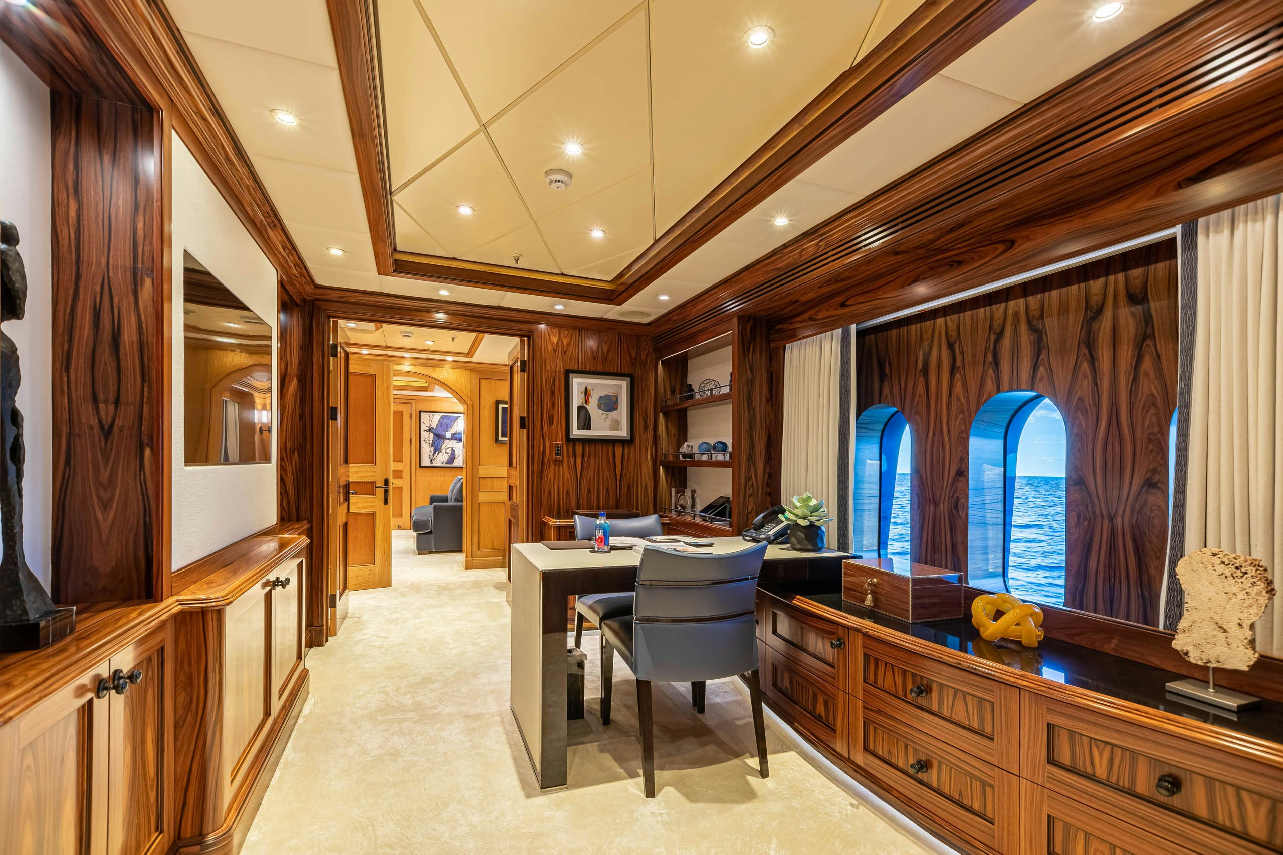 a large room with a desk and a chair aboard UNBRIDLED Yacht for Charter