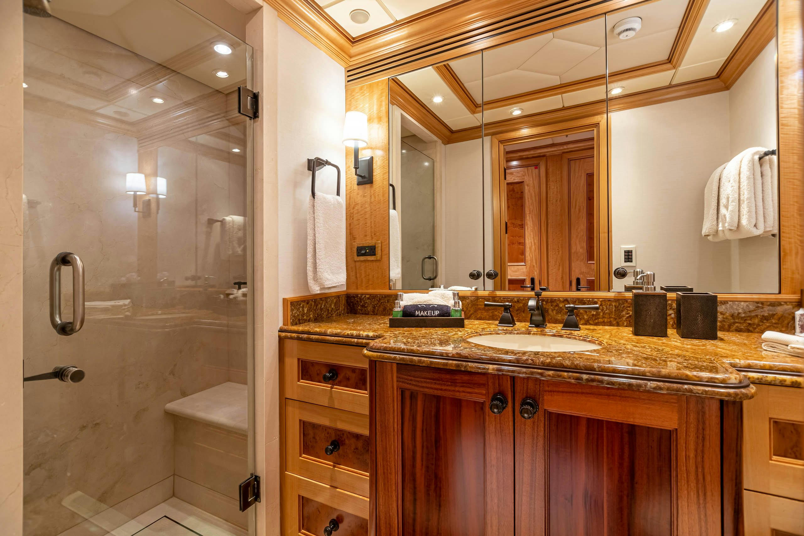 a bathroom with a large mirror aboard UNBRIDLED Yacht for Charter