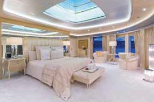 a large bedroom with a large bed aboard LADY LARA Yacht for Sale