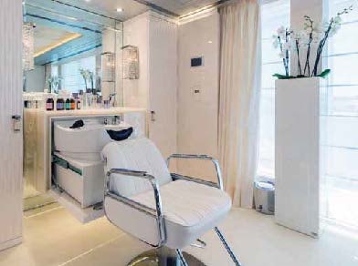 a white chair in a room aboard LADY LARA Yacht for Sale